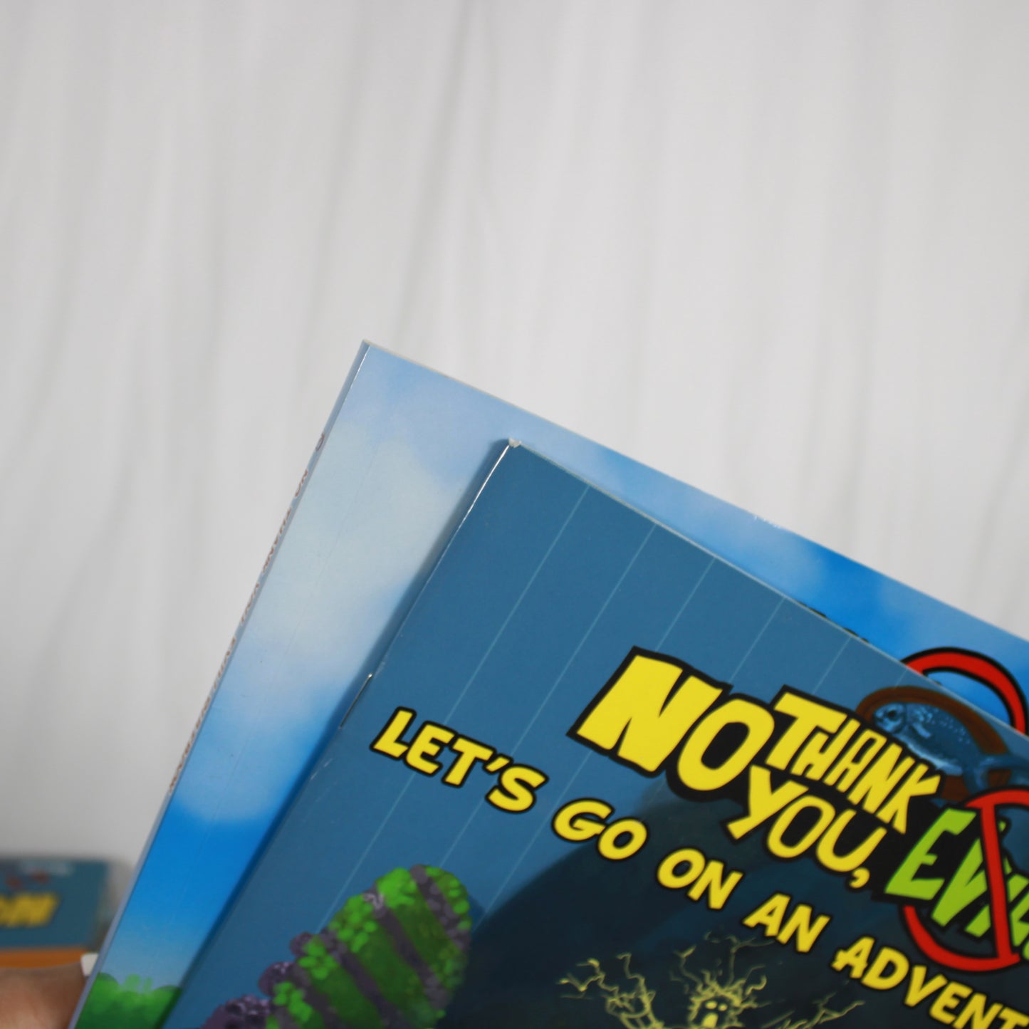 Board game box titled 'No Think You, Evil!' with colorful graphics and text.