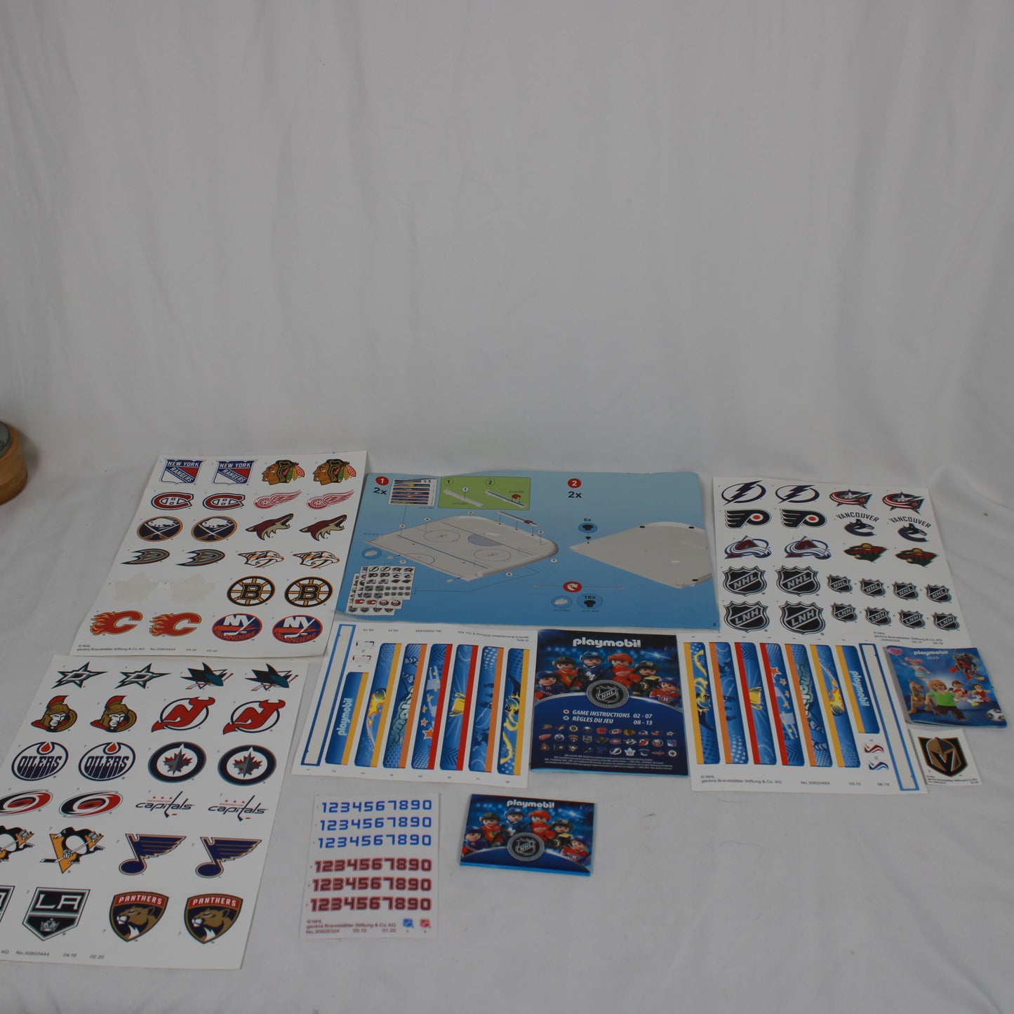 Collection of hockey team logos and stickers on a white background