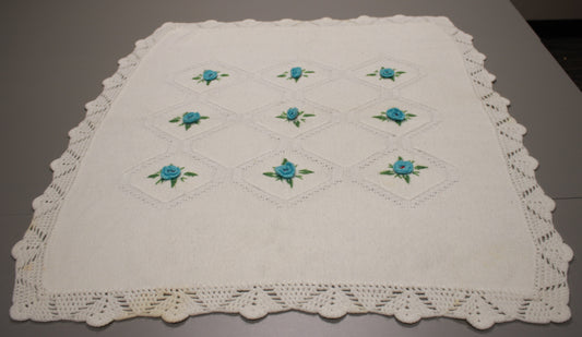 Hand-Knitted White Baby Blanket with Blue Floral Embroidery