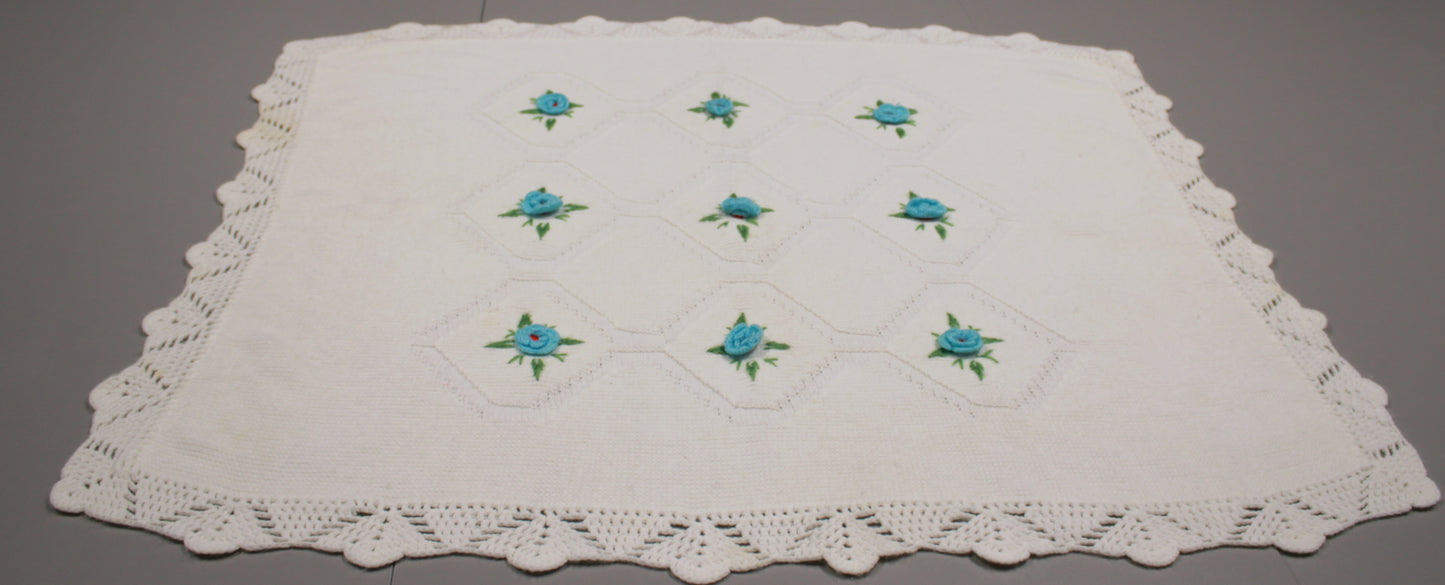 Hand-Knitted White Baby Blanket with Blue Floral Embroidery