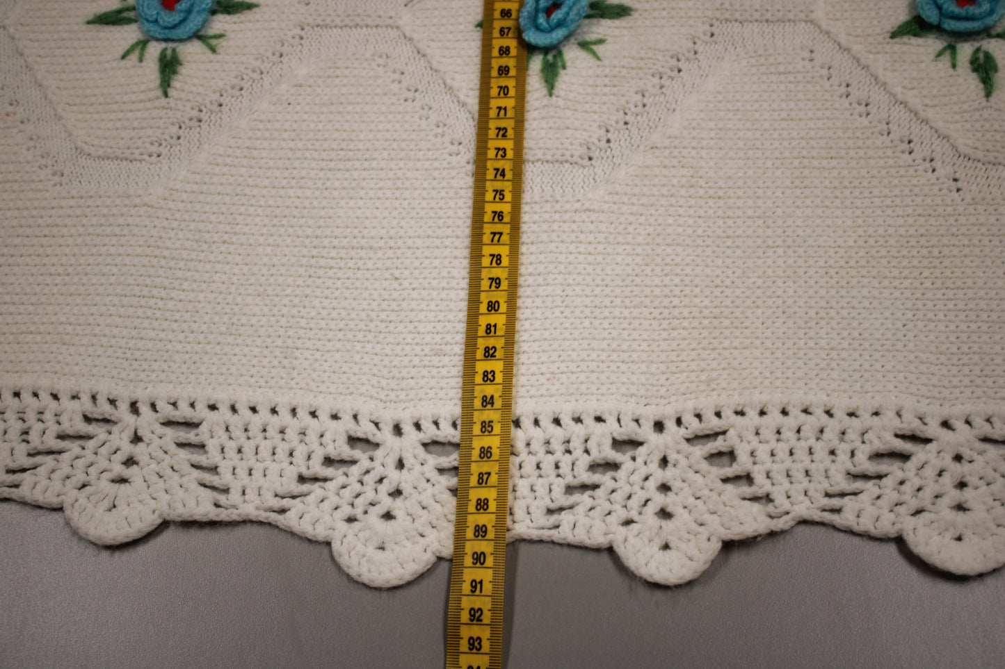 Hand-Knitted White Baby Blanket with Blue Floral Embroidery