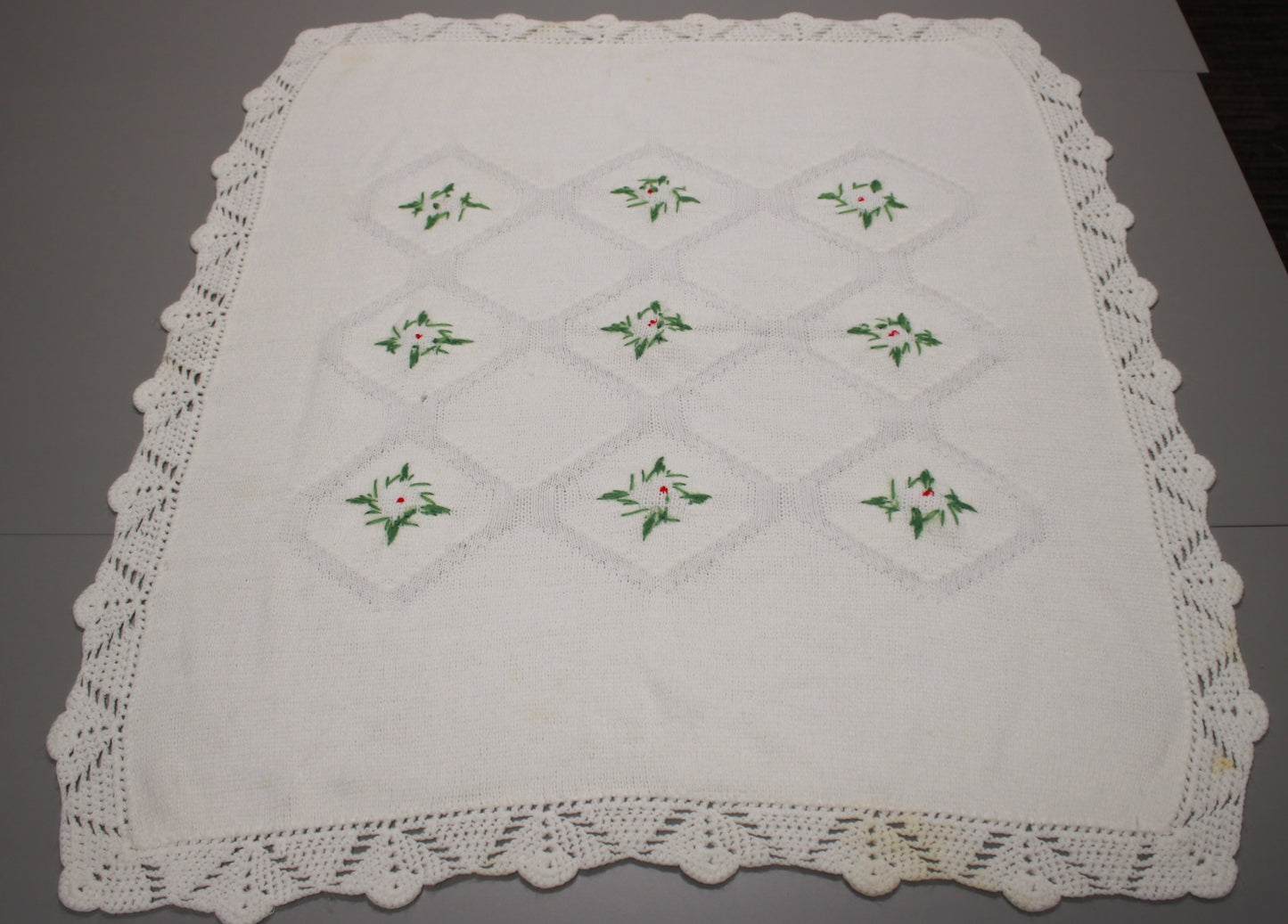 Hand-Knitted White Baby Blanket with Blue Floral Embroidery