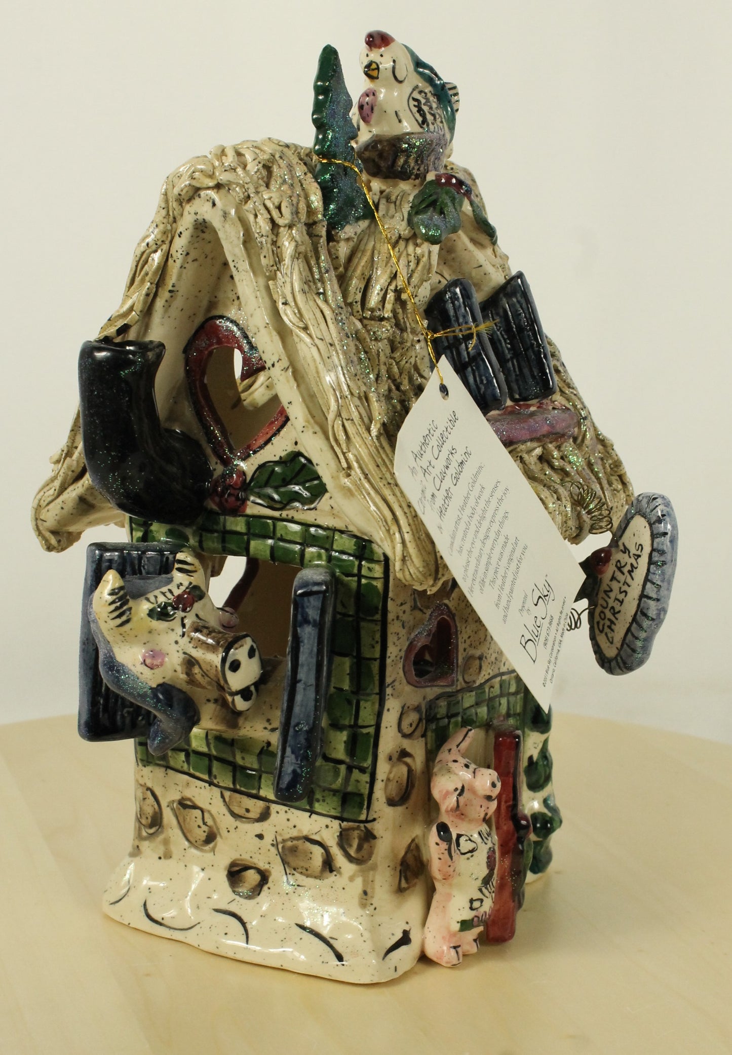 Blue Sky Clayworks by Heather Goldminc Ceramic Santa & Thatched Roof House Decorations