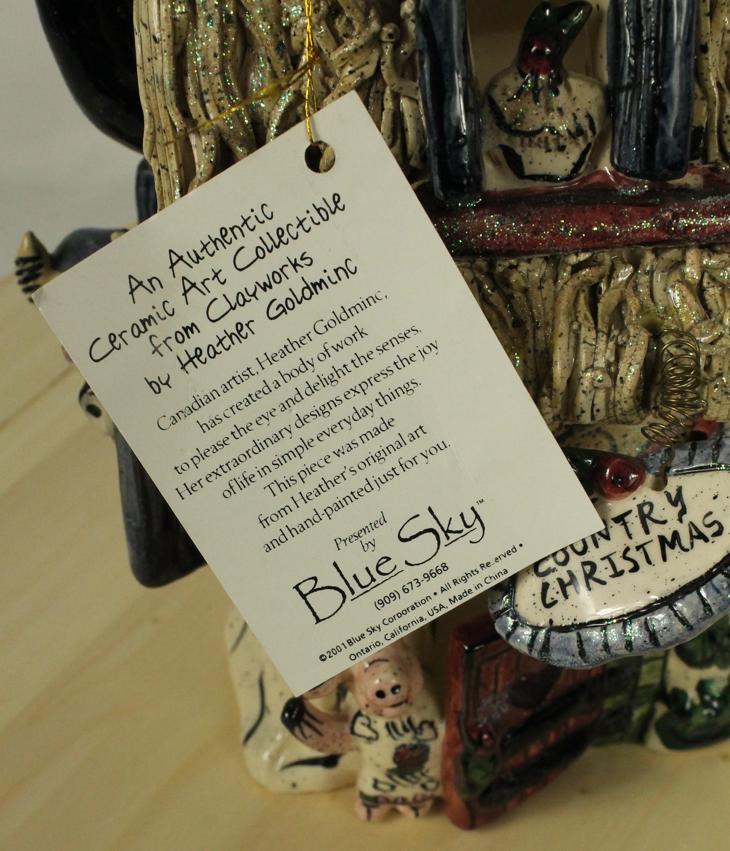 Blue Sky Clayworks by Heather Goldminc Ceramic Santa & Thatched Roof House Decorations