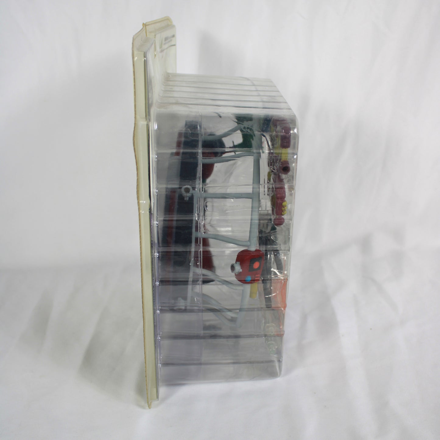 Clear plastic packaging with a toy inside on a white background