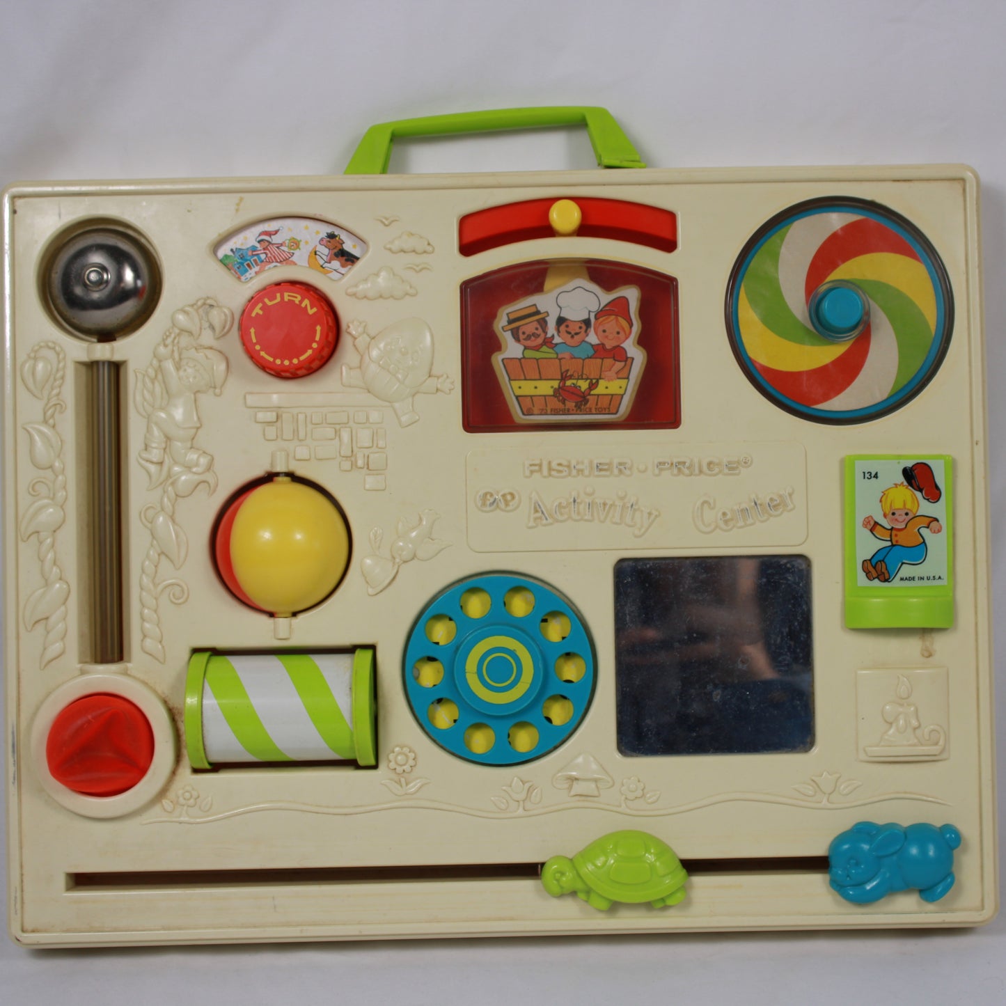 Vintage Fisher-Price educational toy with colorful buttons and shapes on a white background