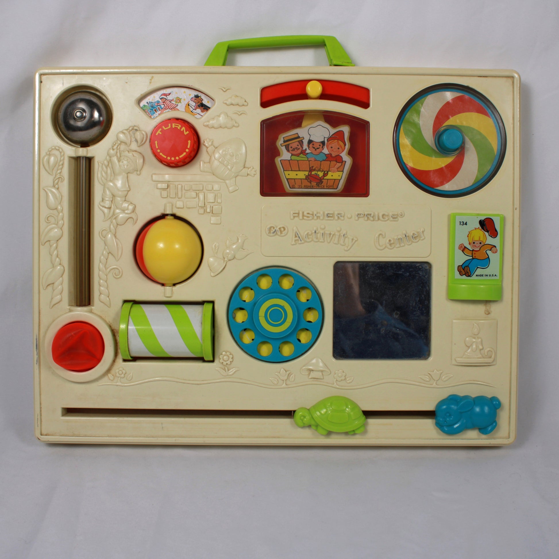 Vintage Fisher-Price educational toy with colorful buttons and shapes on a white background