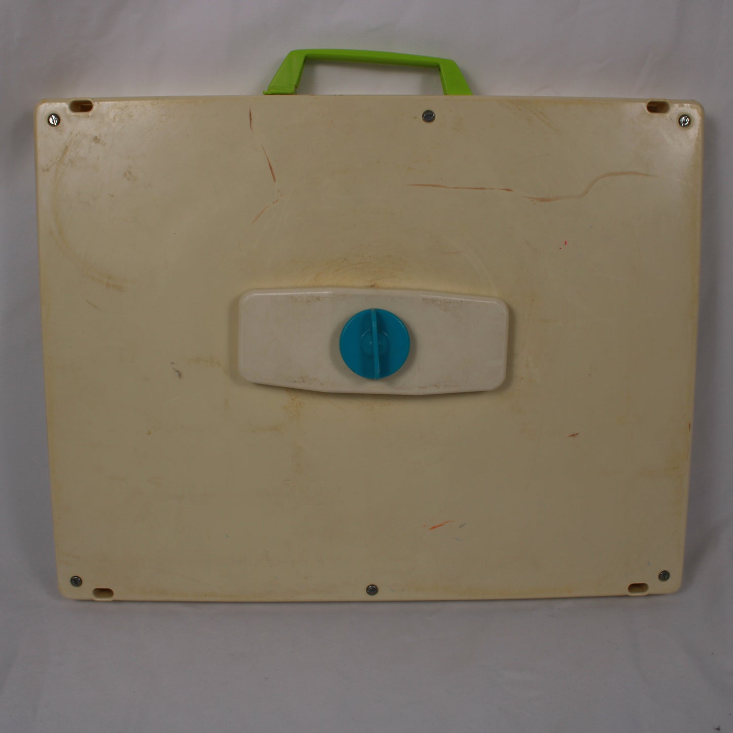Beige board with a blue circular handle and green handle on a white background