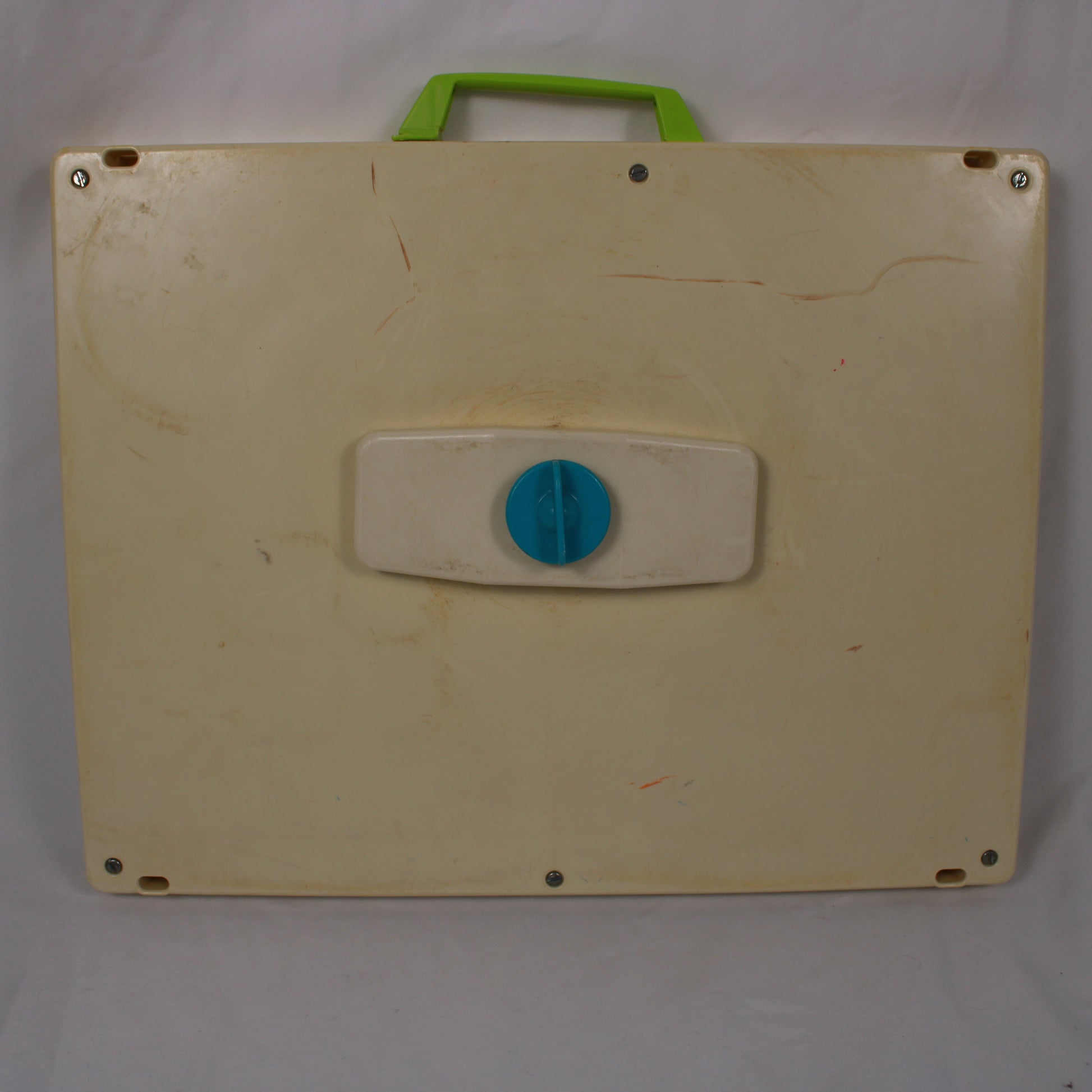Beige board with a blue circular handle and green handle on a white background