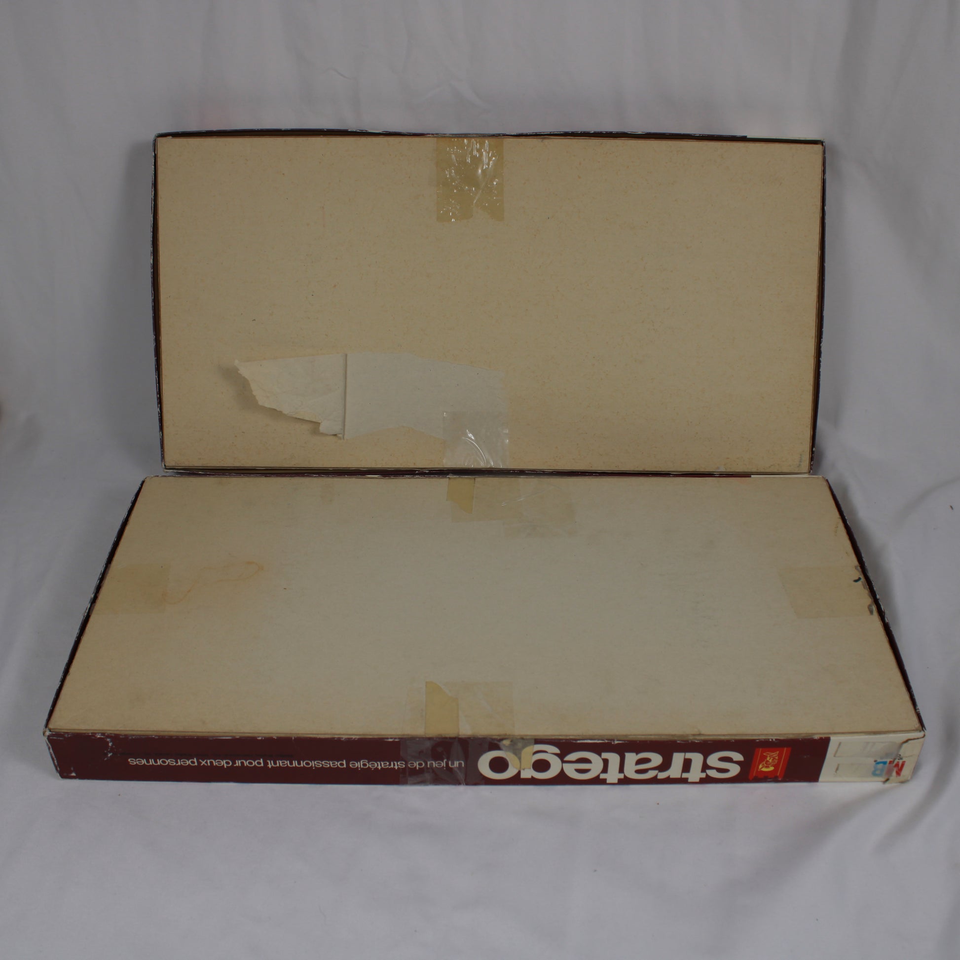 Vintage 'Stratego' board game box with visible wear on a white background
