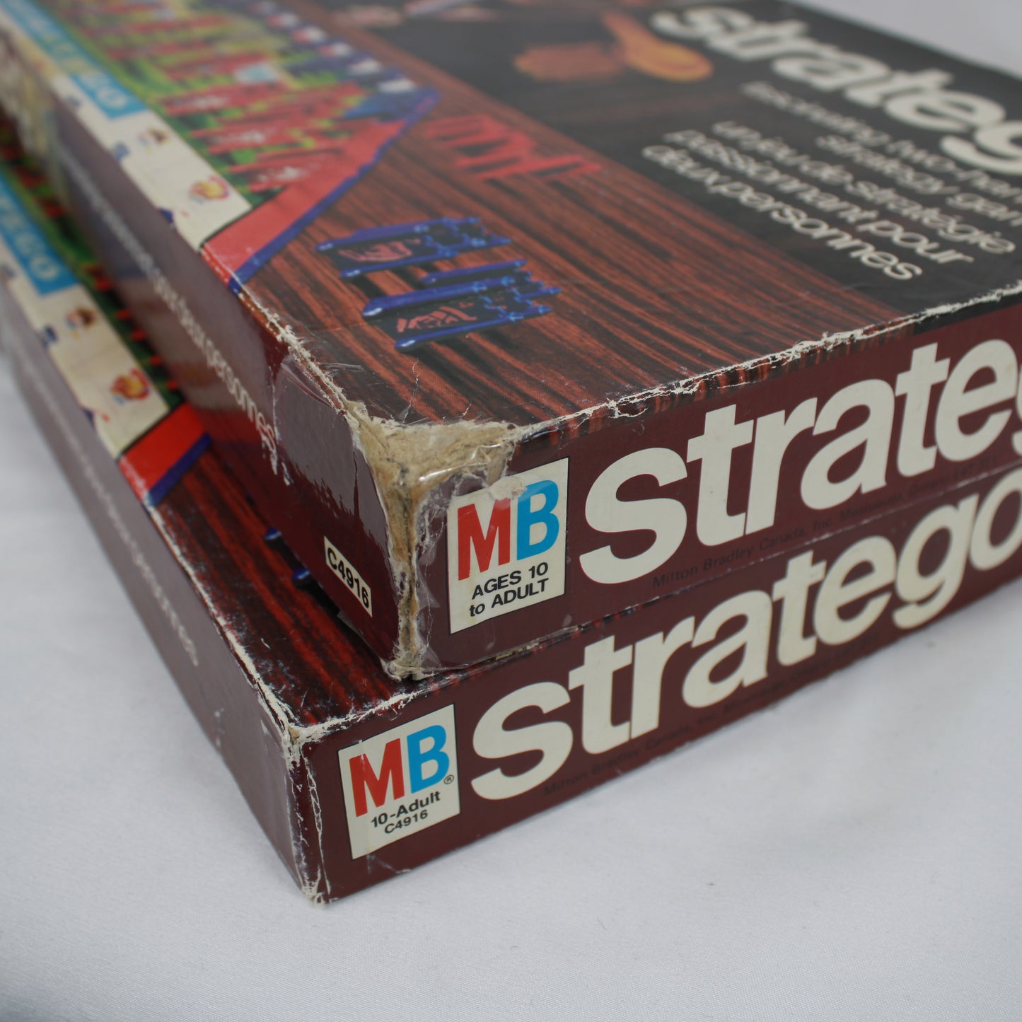 Vintage 'Stratego' board game box with colorful pieces on a white background