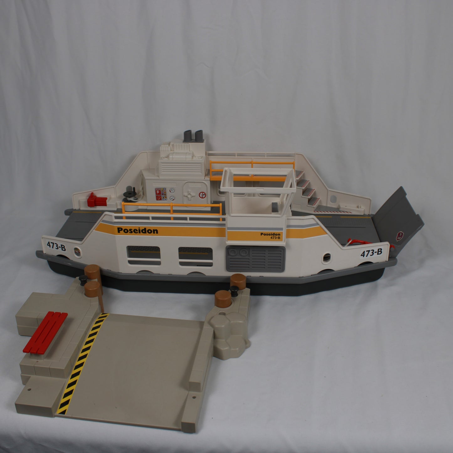 Model ferry boat with 'Poseidon' branding on a white background