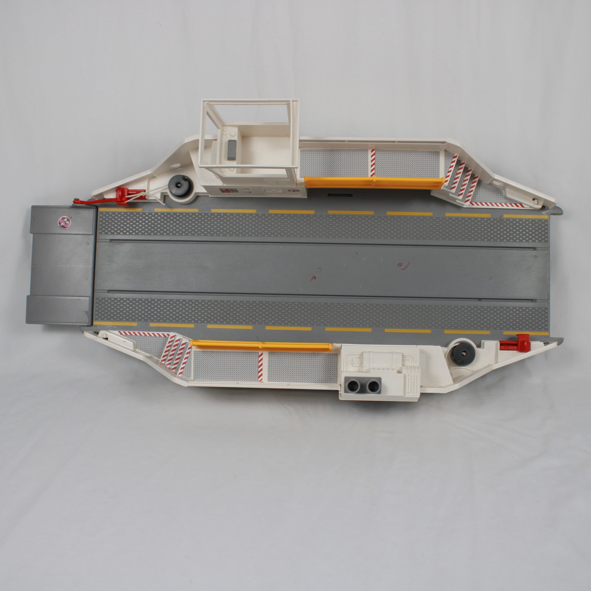 Model of a flatbed truck with a crane on a gray background