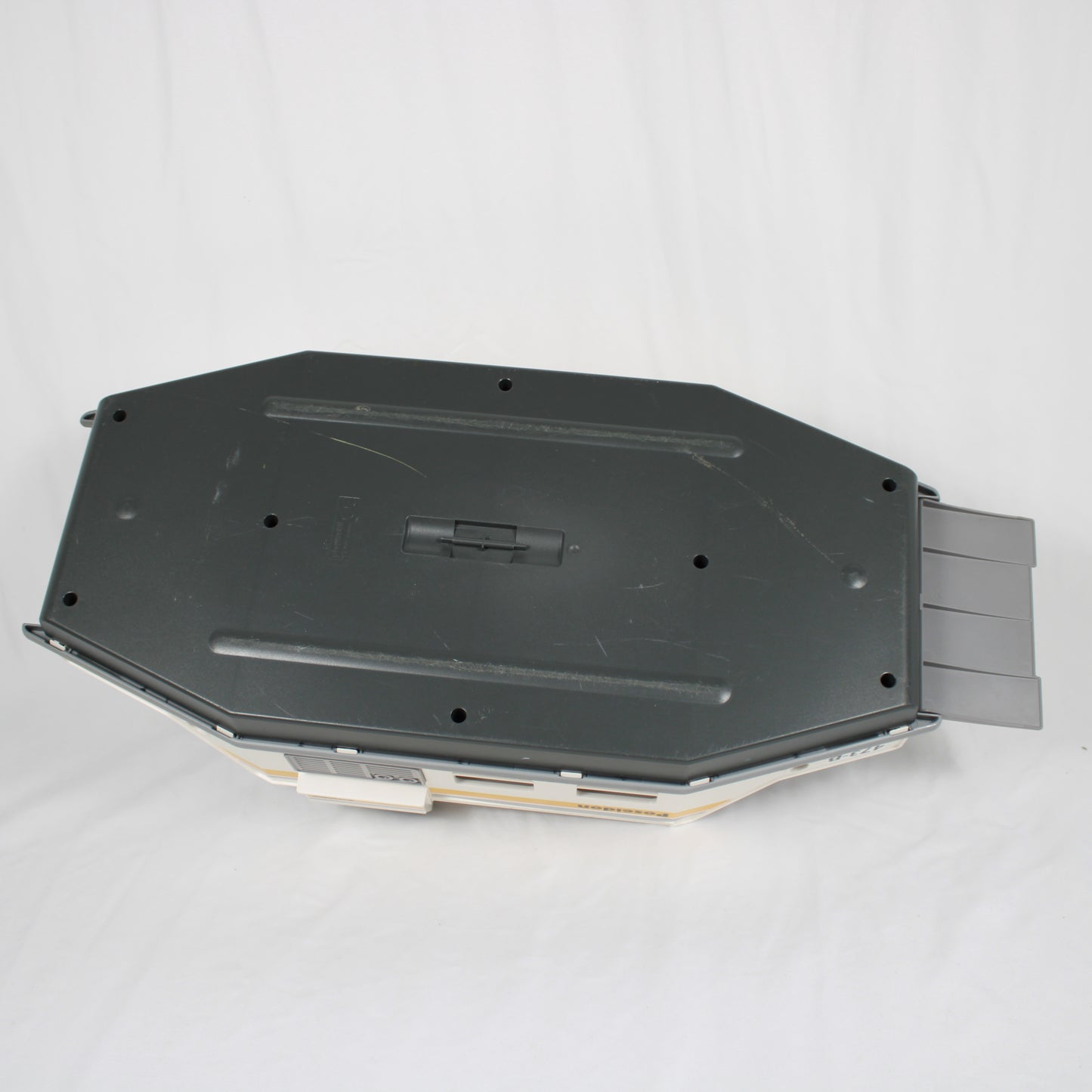Black plastic component on a white background