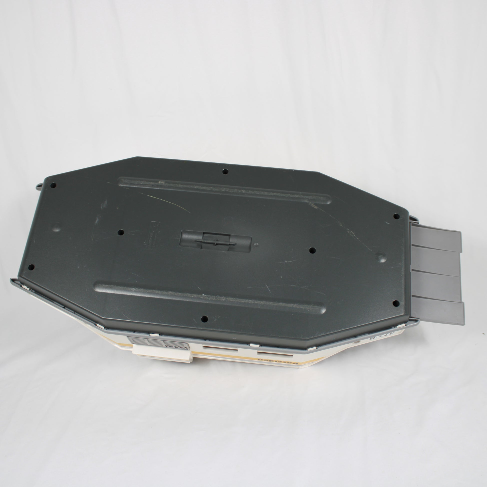 Black plastic component on a white background
