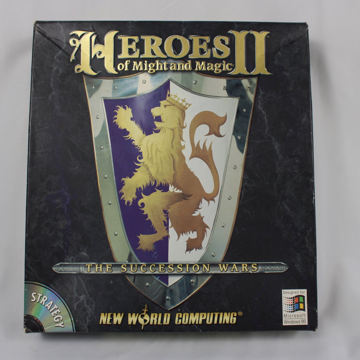 Box of 'Heroes of Might and Magic II: The Succession Wars' by New World Computing on a gray background