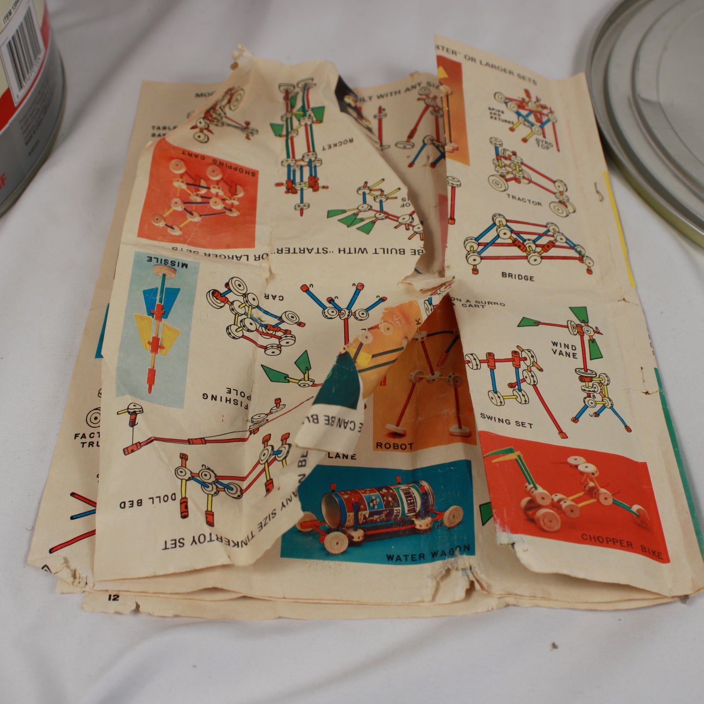 Vintage toy catalog with illustrations of toys on a white surface