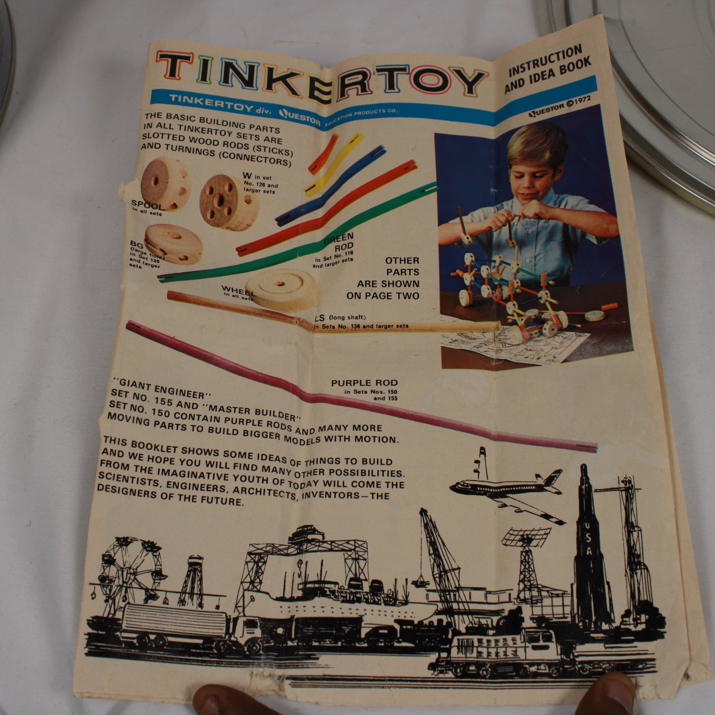 Vintage Tinkertoy instruction and idea book on a white background