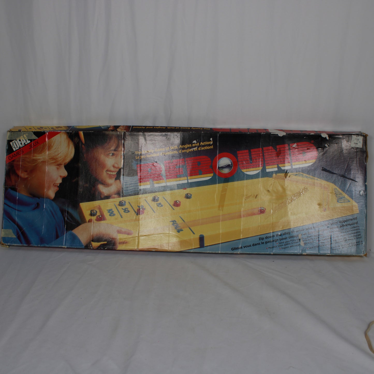 Vintage 'Around the World' board game box on a white background