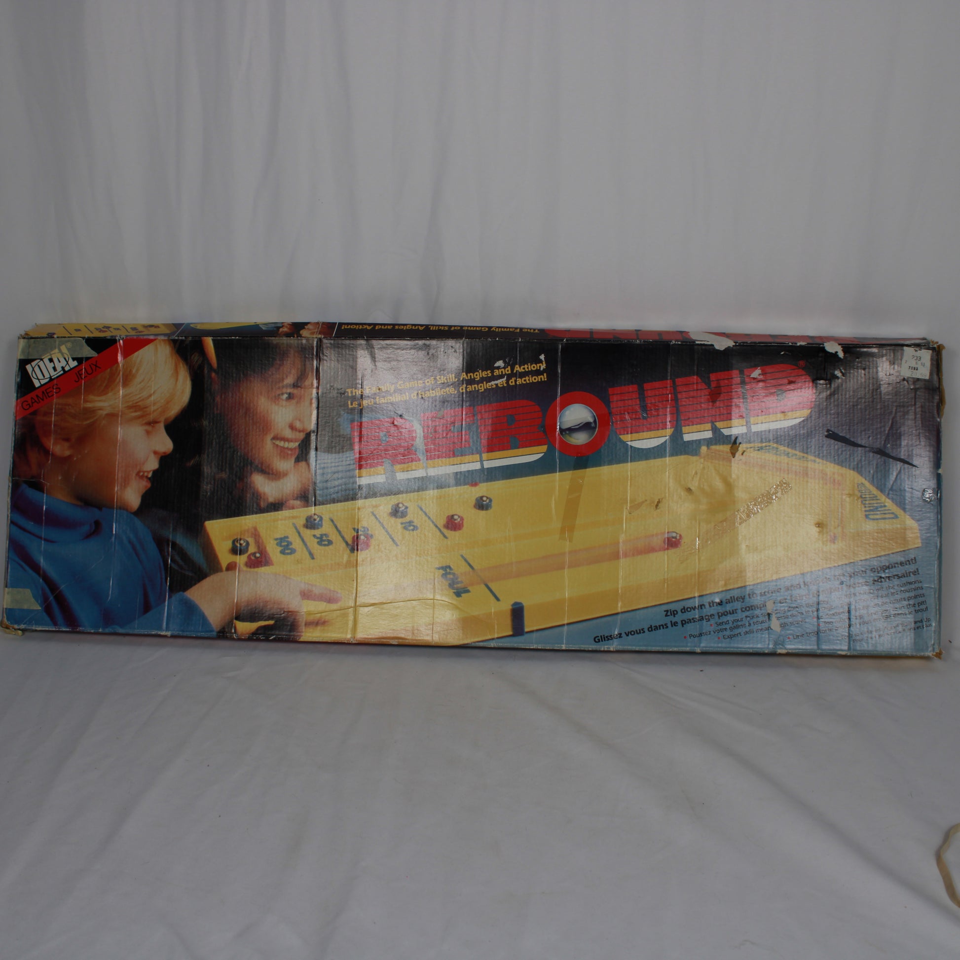 Vintage 'Around the World' board game box on a white background