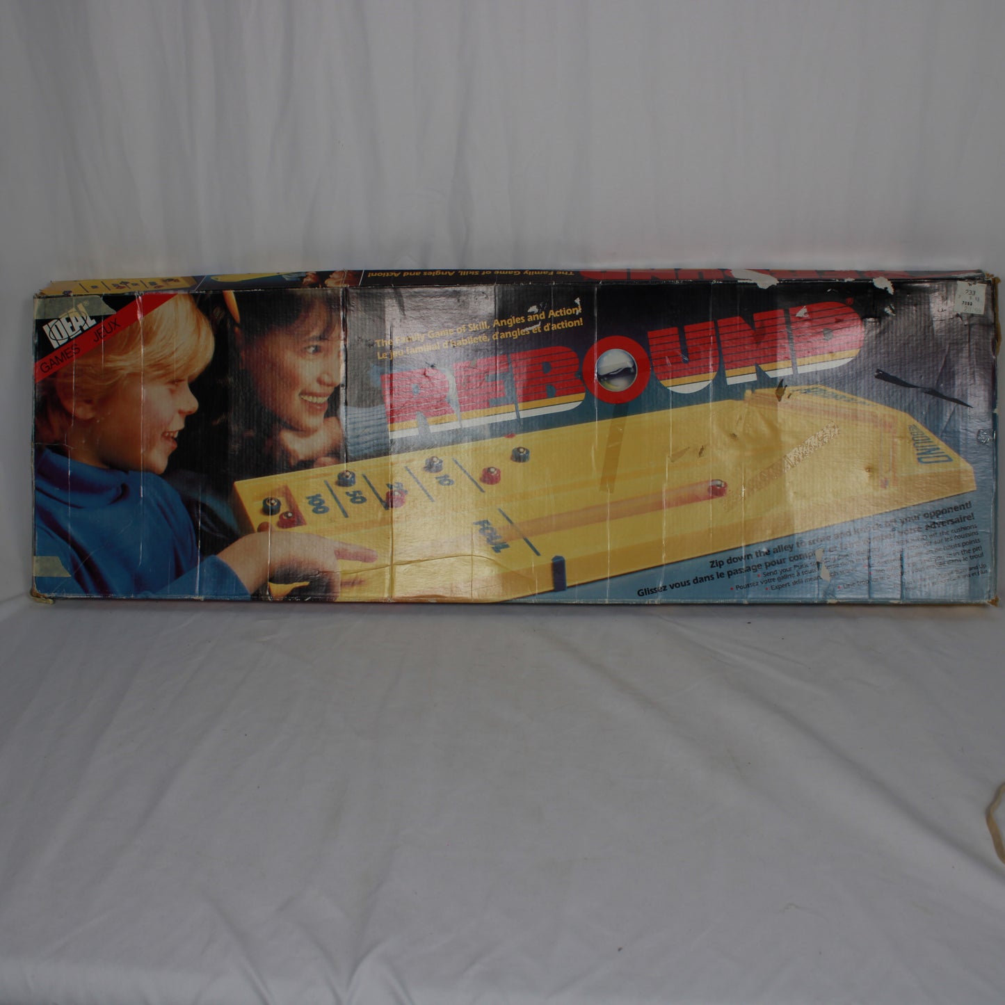 Vintage 'Rebound' game box with children playing on a plain background