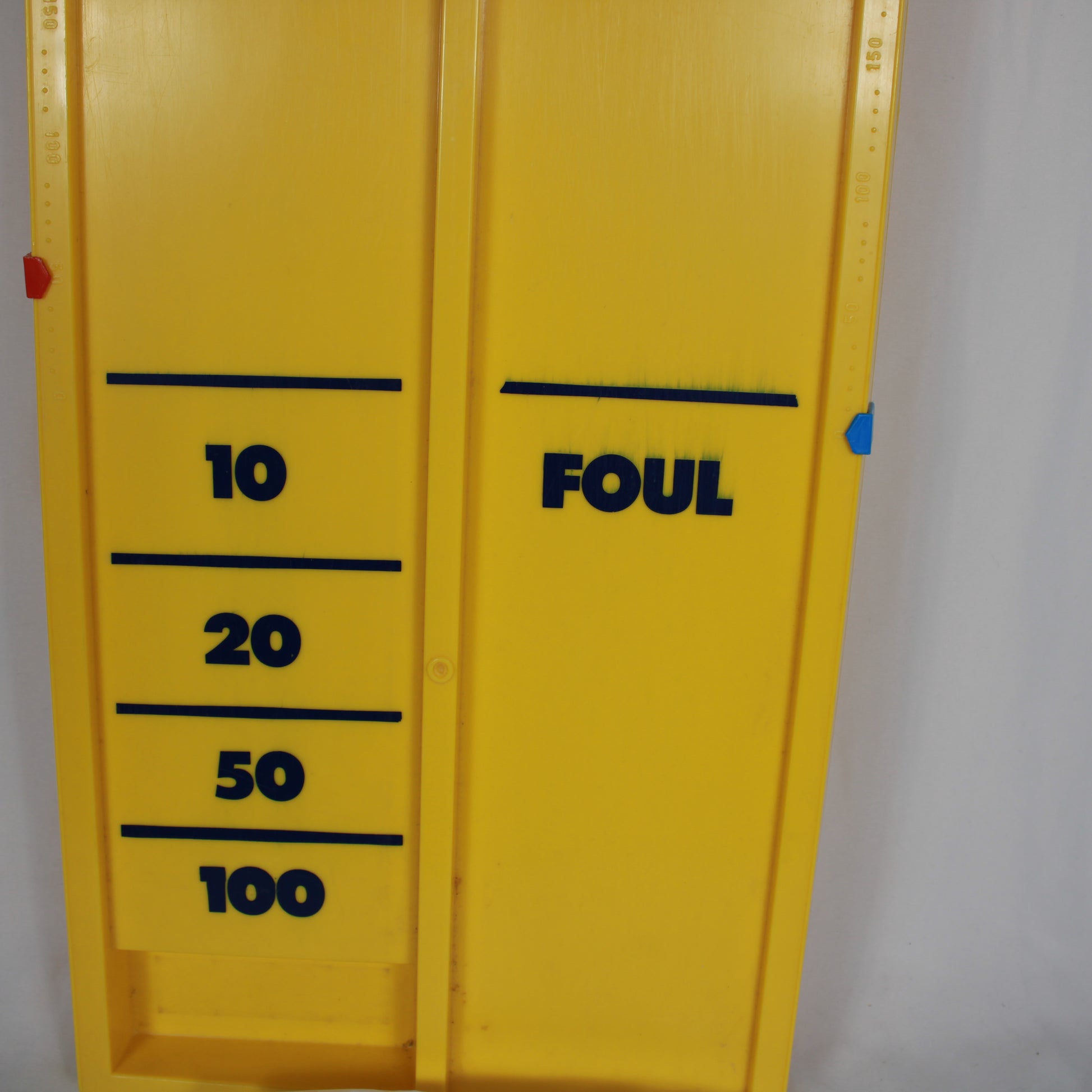 Yellow device with black text and numbers on a white background
