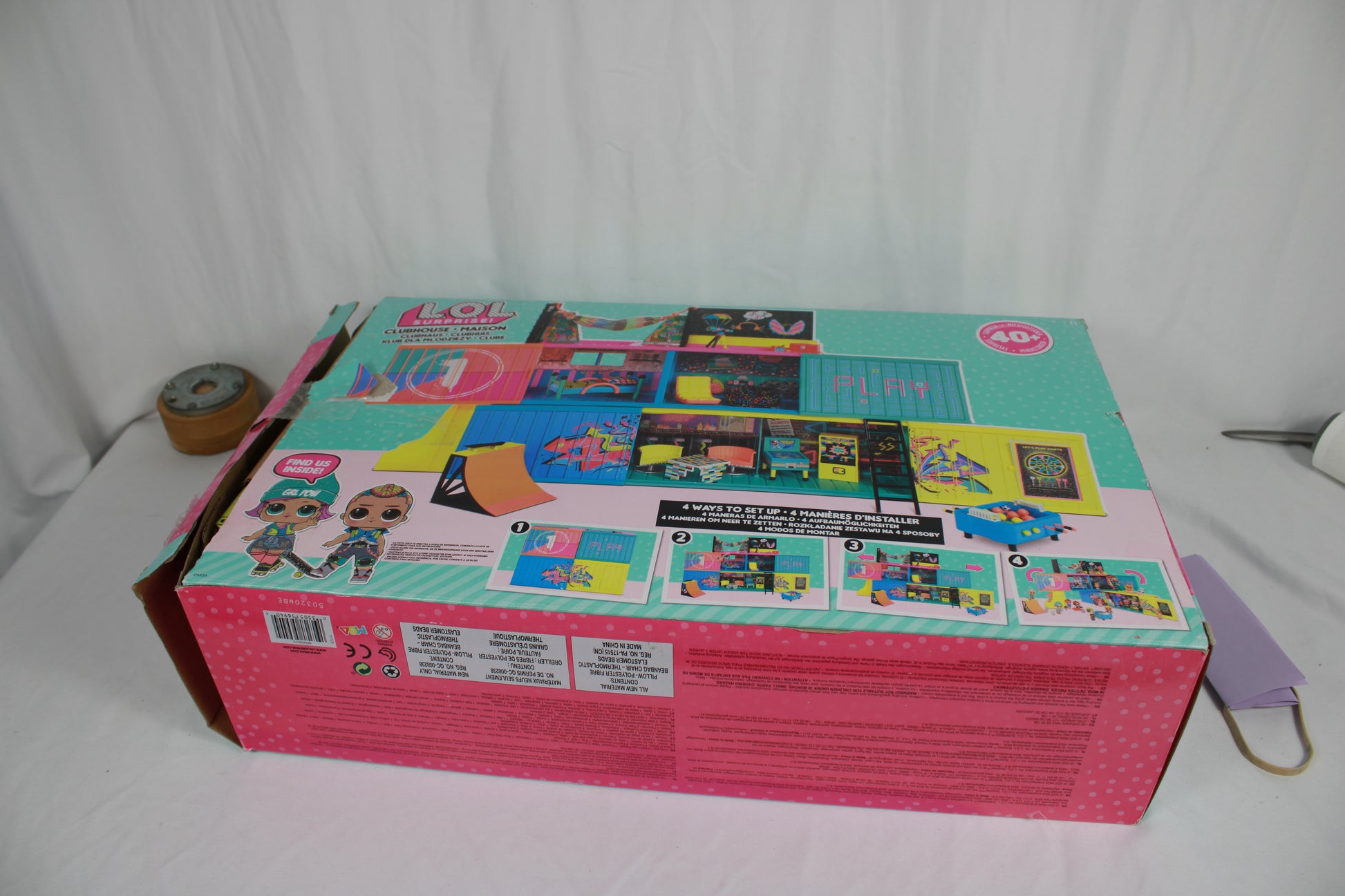 Colorful toy box with multiple images of toys on a white background