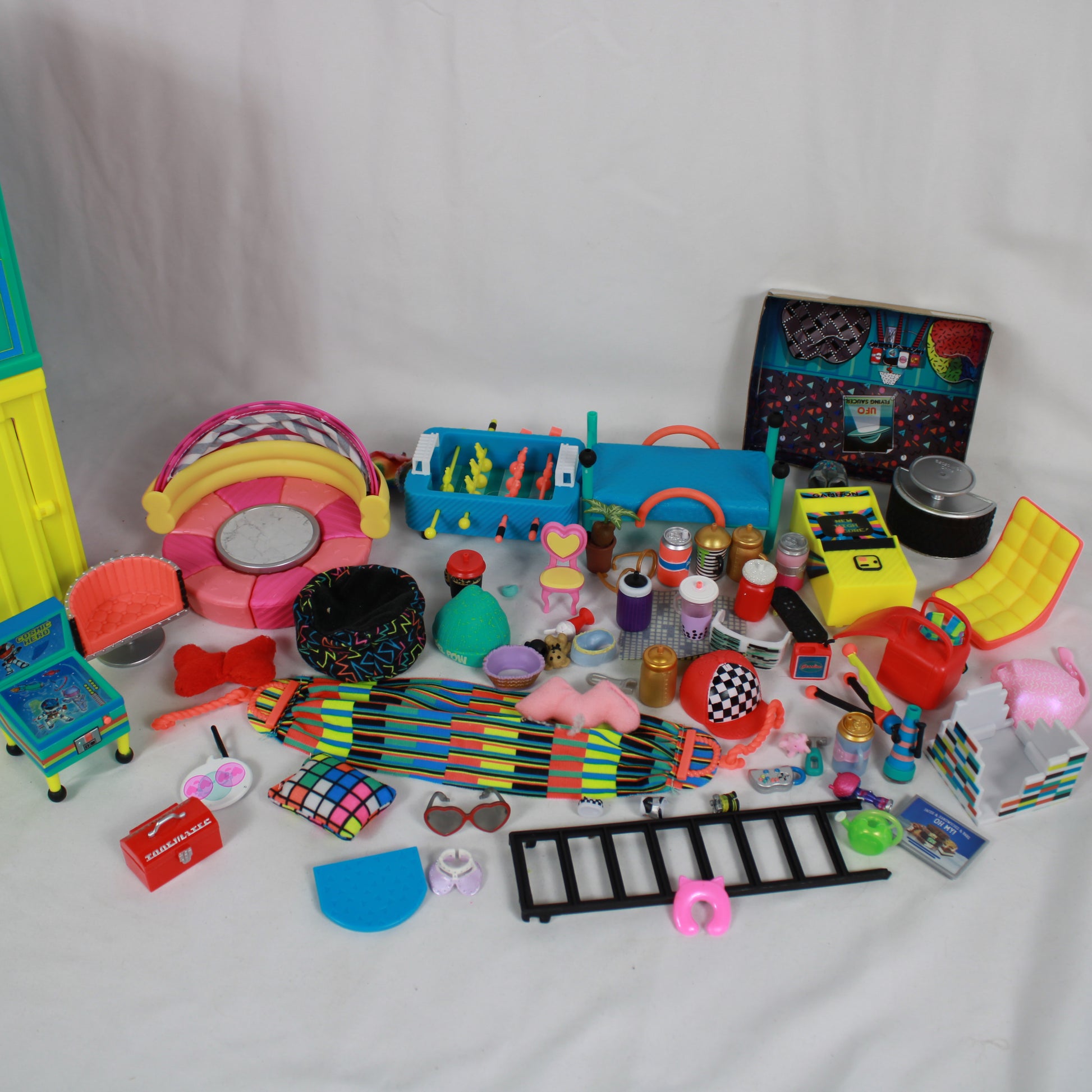 Collection of colorful toys and accessories on a white background