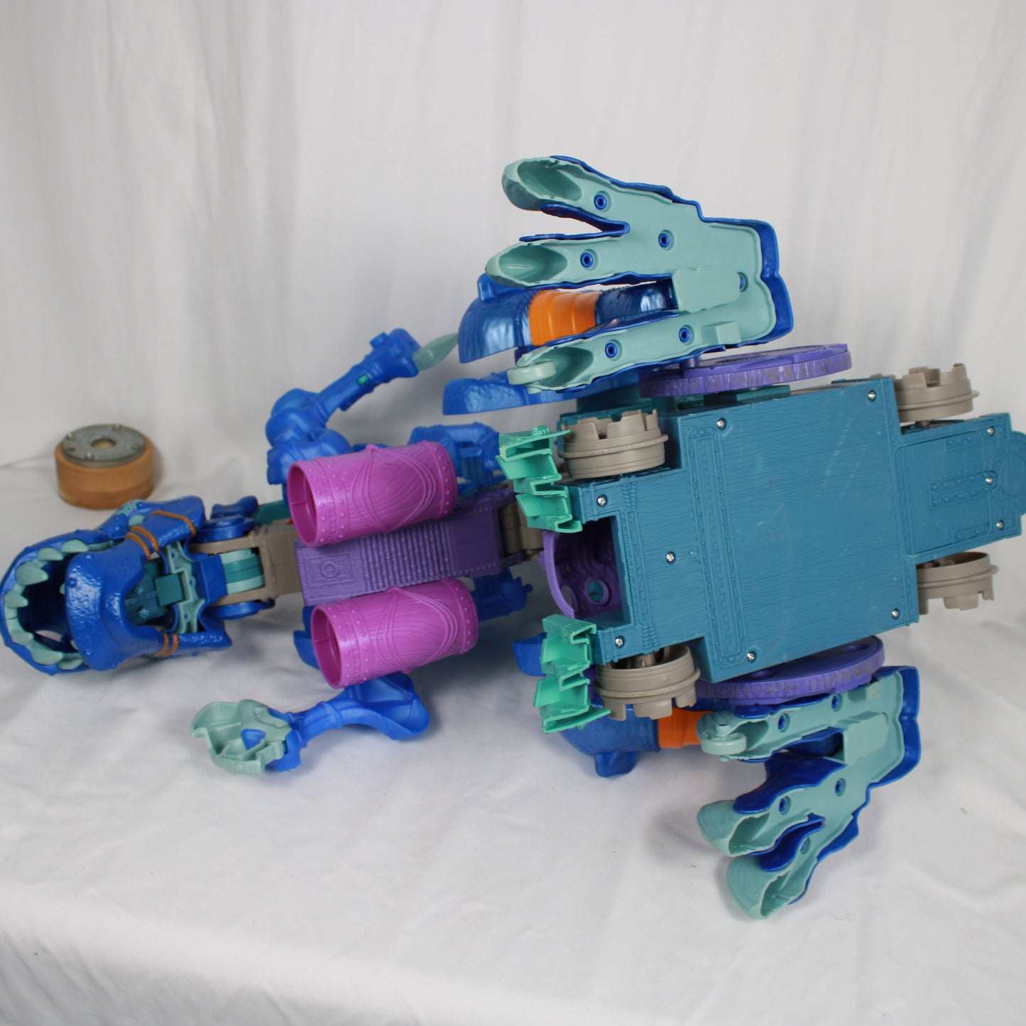 Toy robot with blue and purple colors on a white background