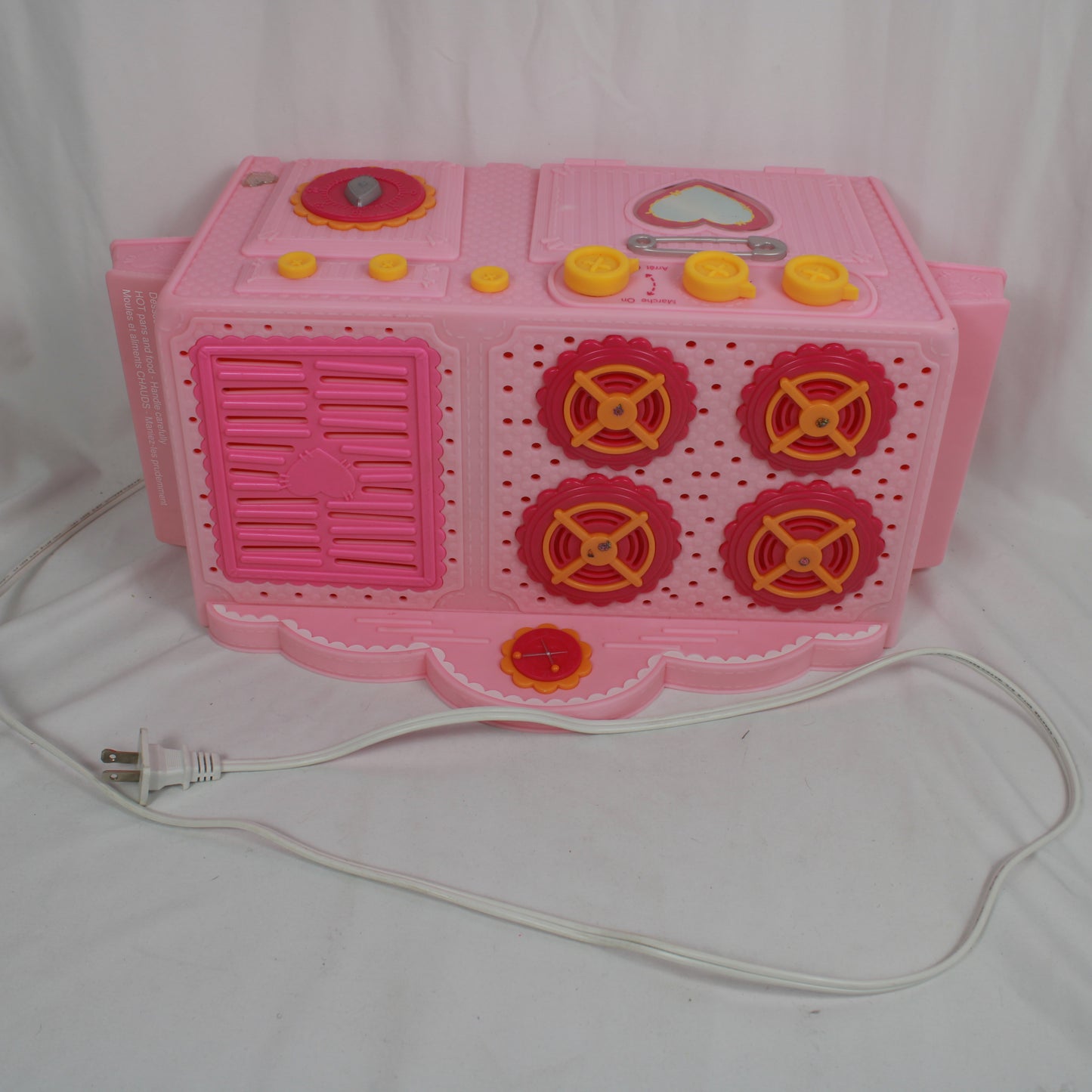 Pink toy kitchen set with a white background