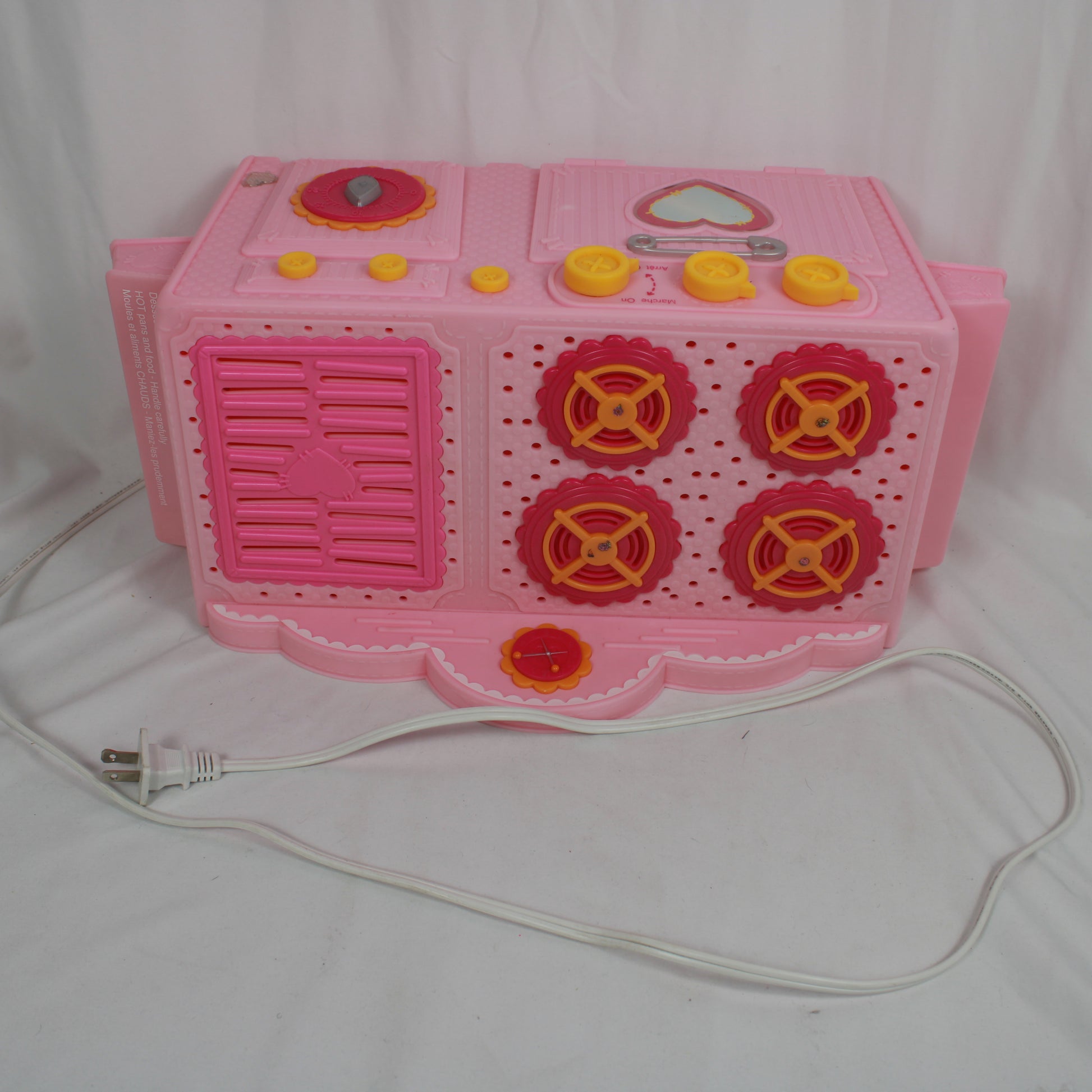 Pink toy kitchen set with a white background