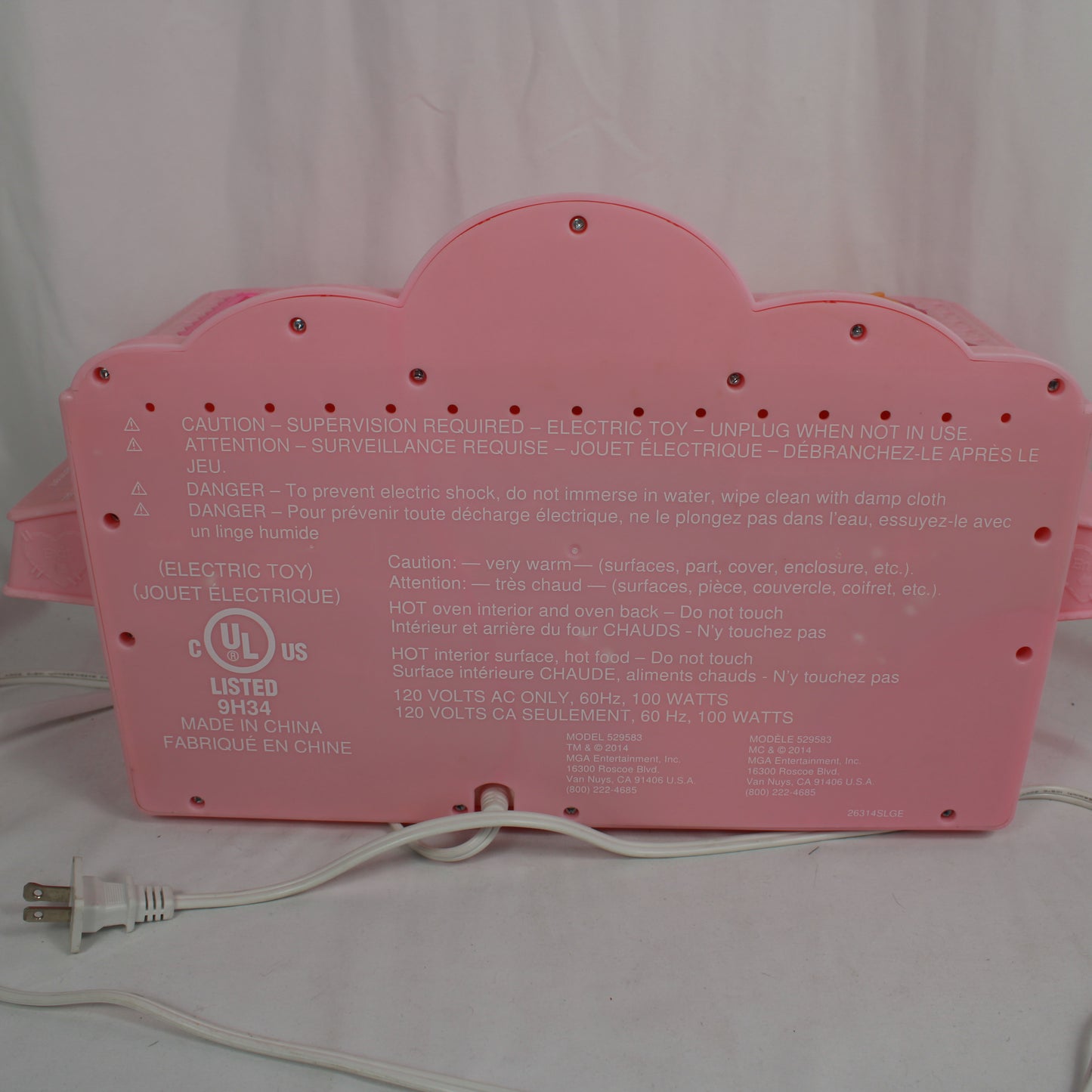 Pink toy with a power cord on a white background