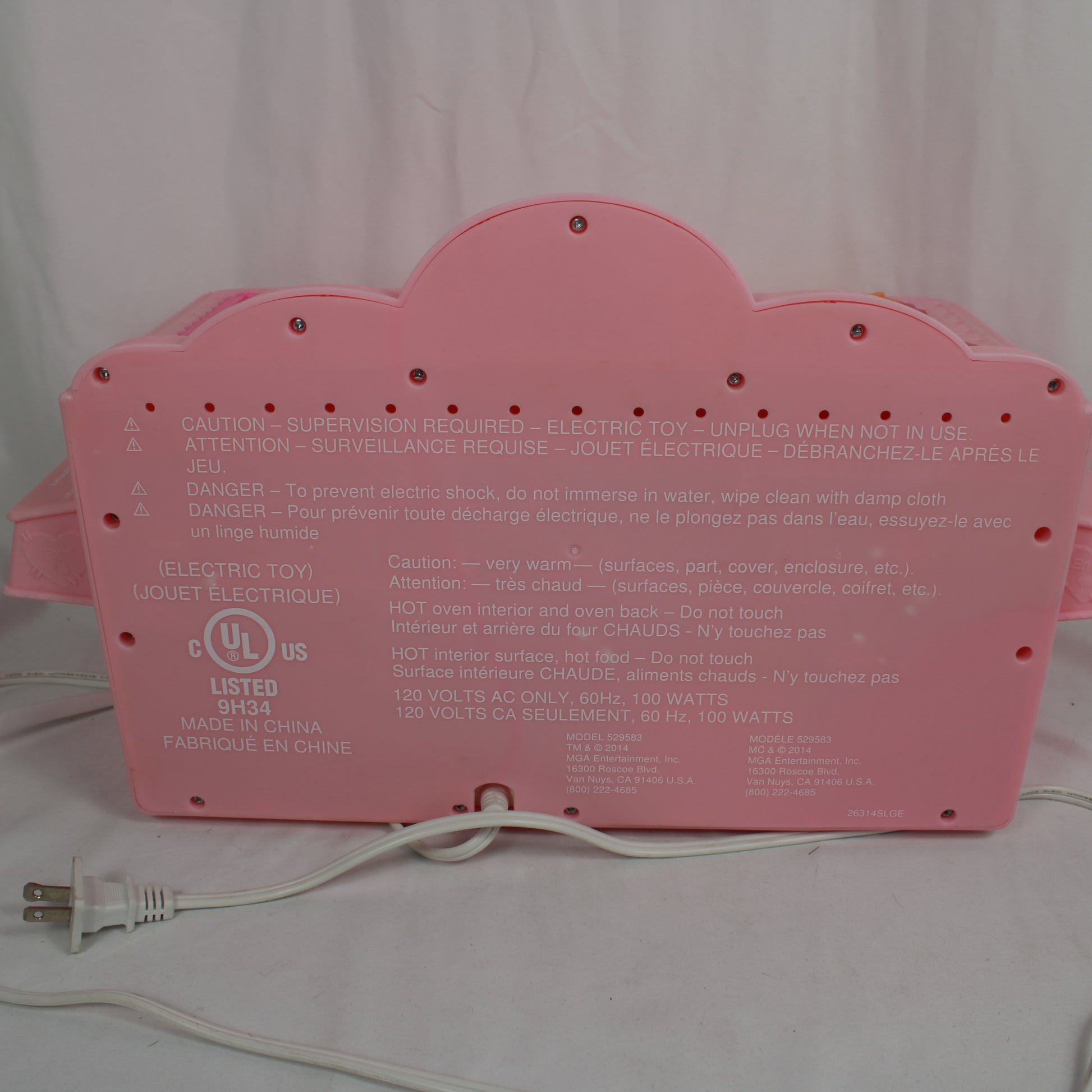 Pink toy with a power cord on a white background