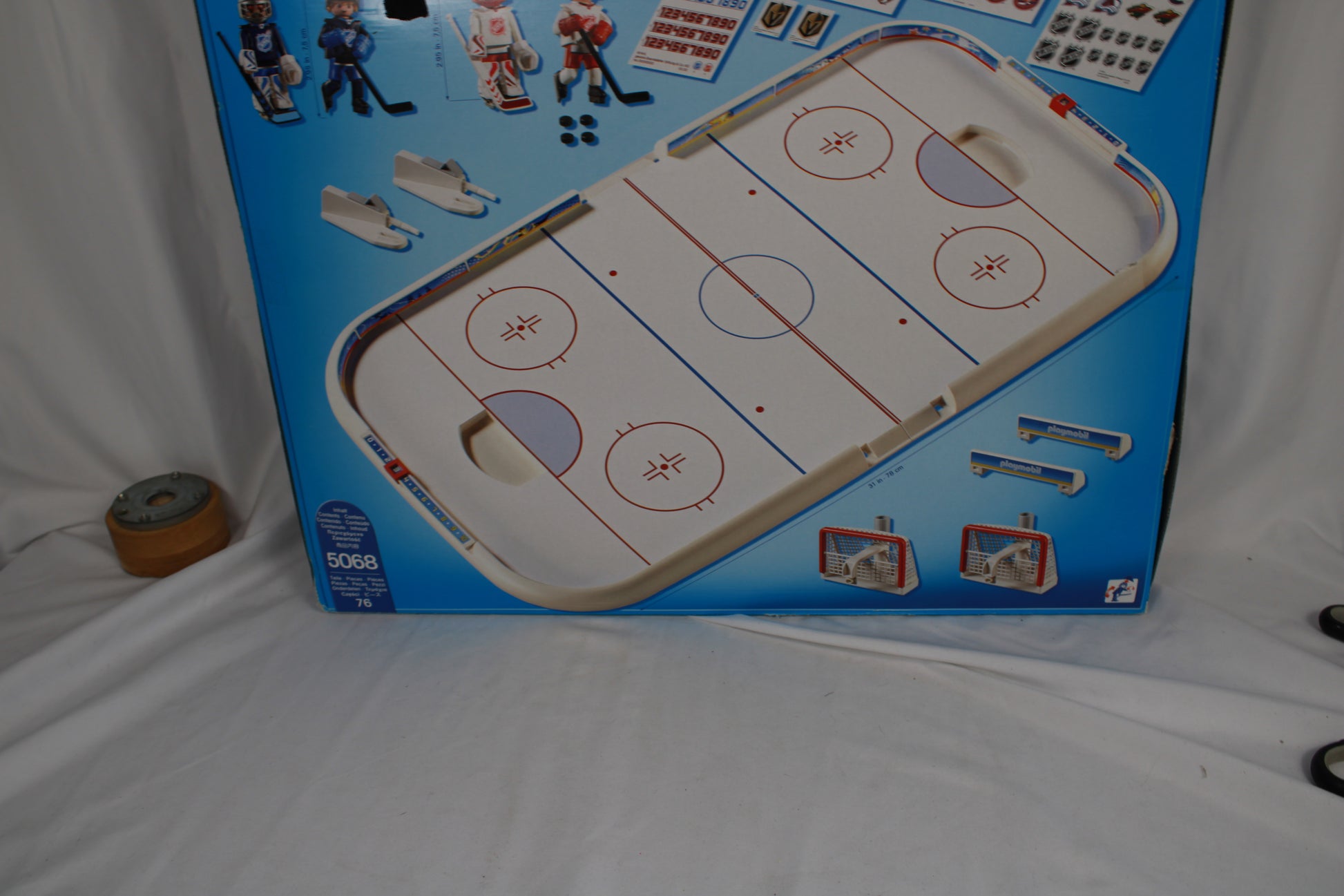 Hockey game set with figures on a blue packaging background