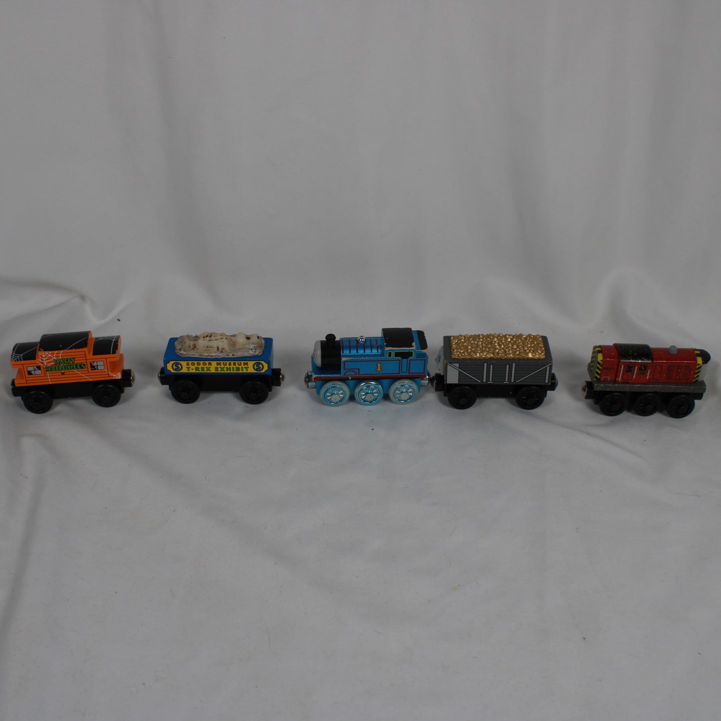 Set of toy trains on a plain background