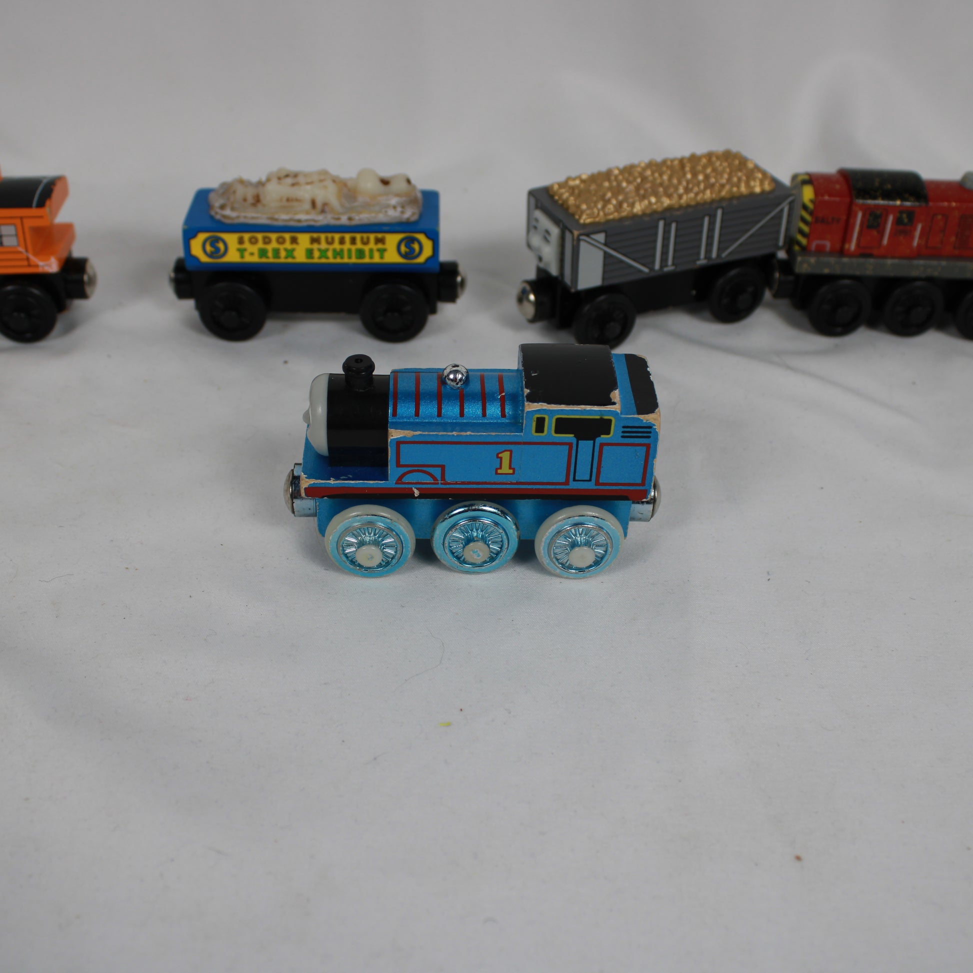 Collection of toy trains on a white background