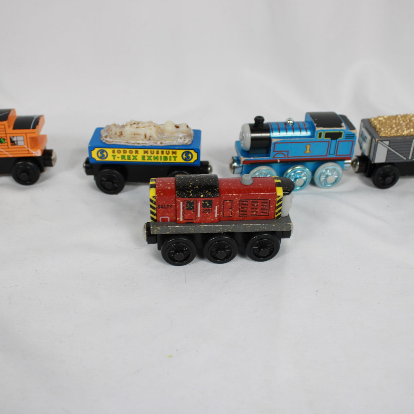 Collection of toy trains on a white background