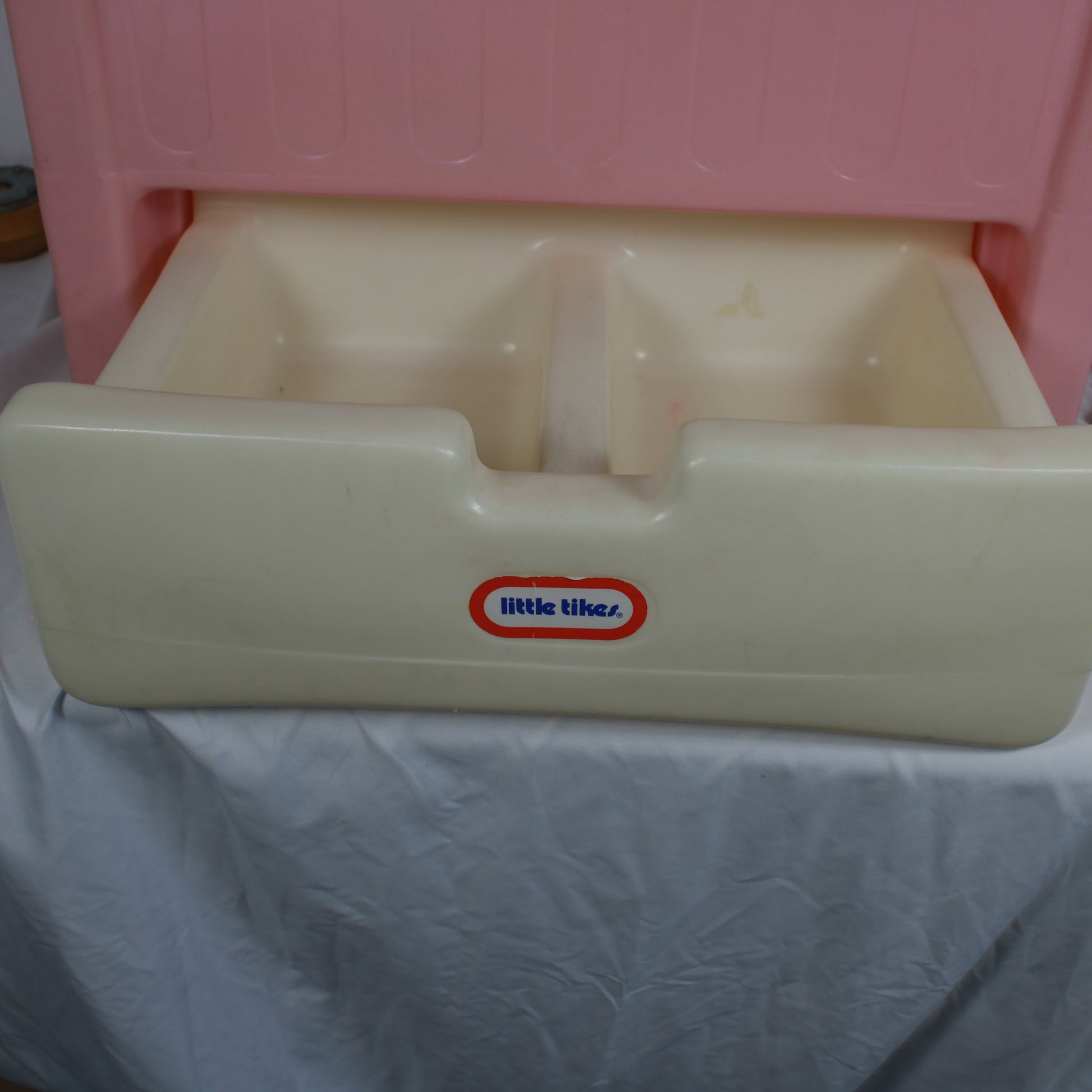 Child's plastic step stool with 'Little Tikes' logo on a white background