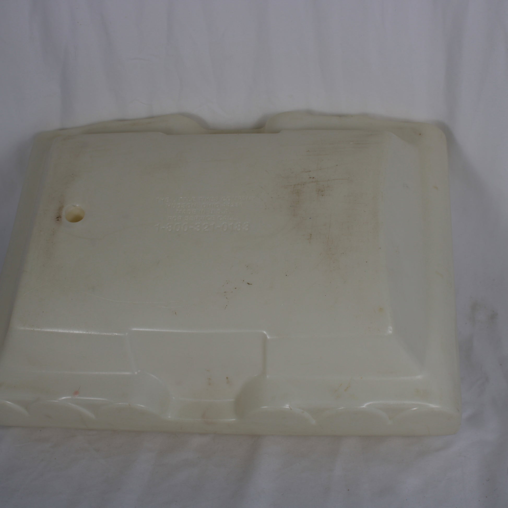Dirty white plastic container on a white background