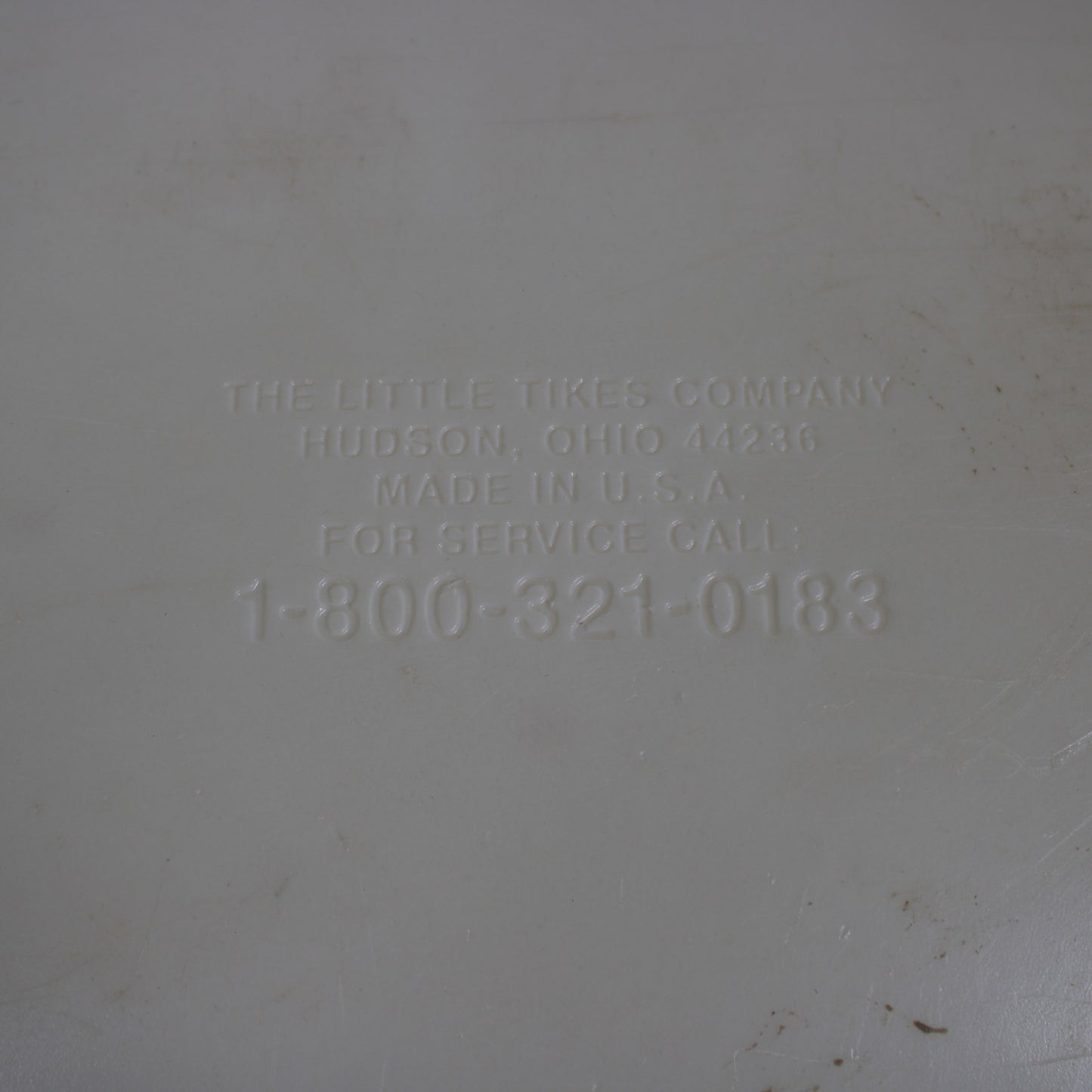 Text on a gray background indicating 'The Little Tikes Company' with contact information.
