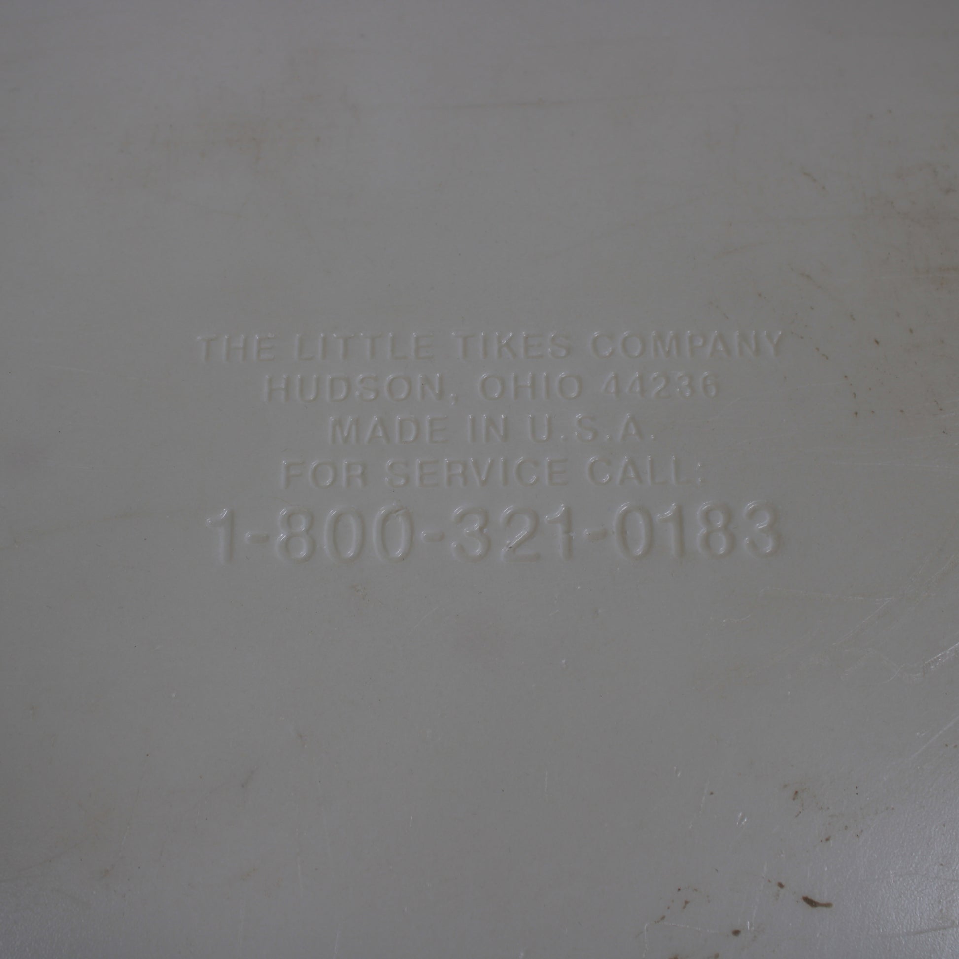 Text on a gray background indicating 'The Little Tikes Company' with contact information.