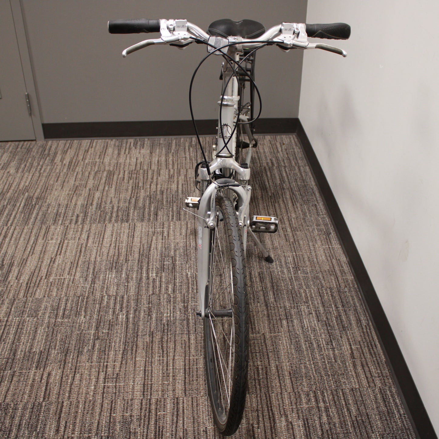 Bicycle inside a building on a carpeted floor