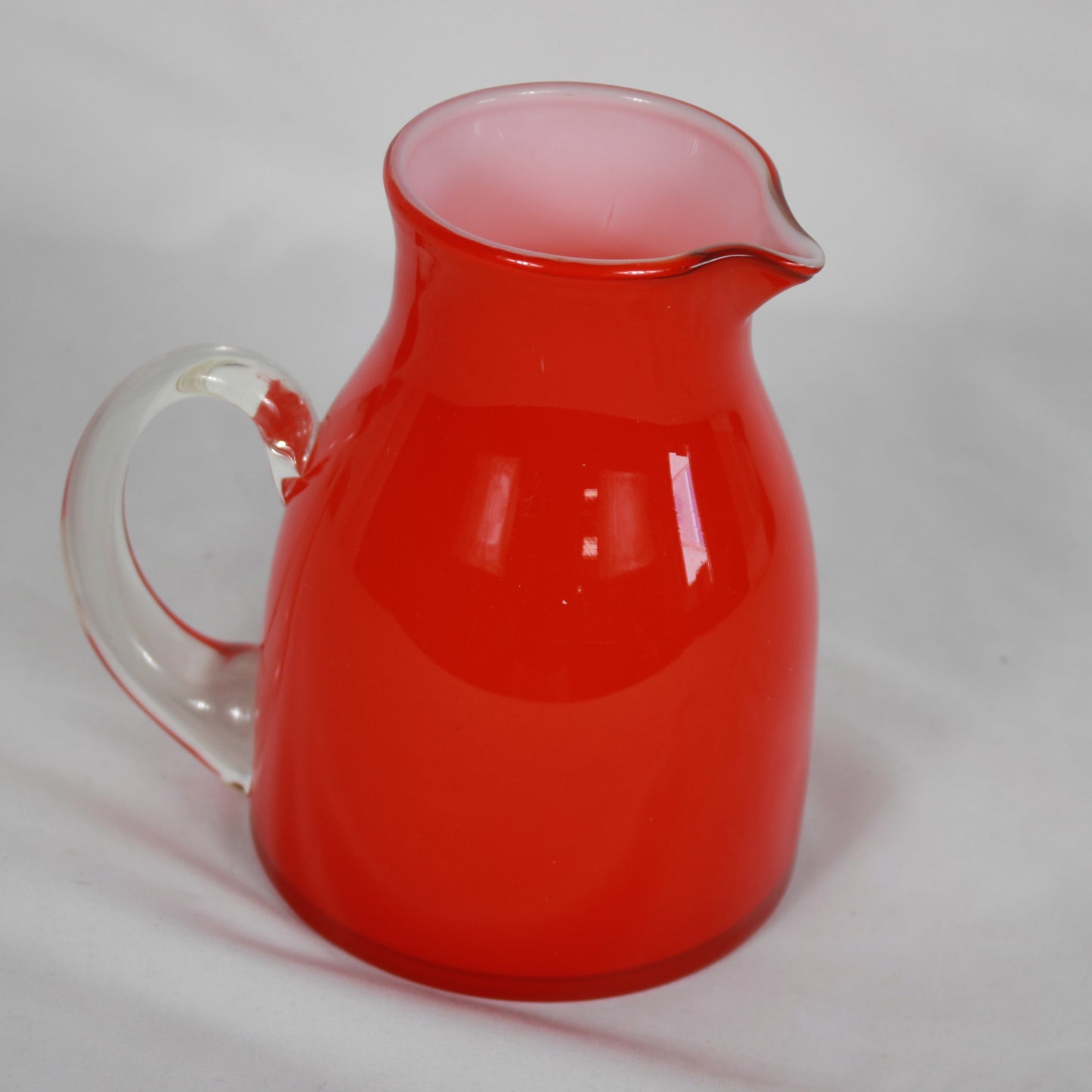 Red Cased Art Glass Creamer Pitcher with Clear Applied Handle