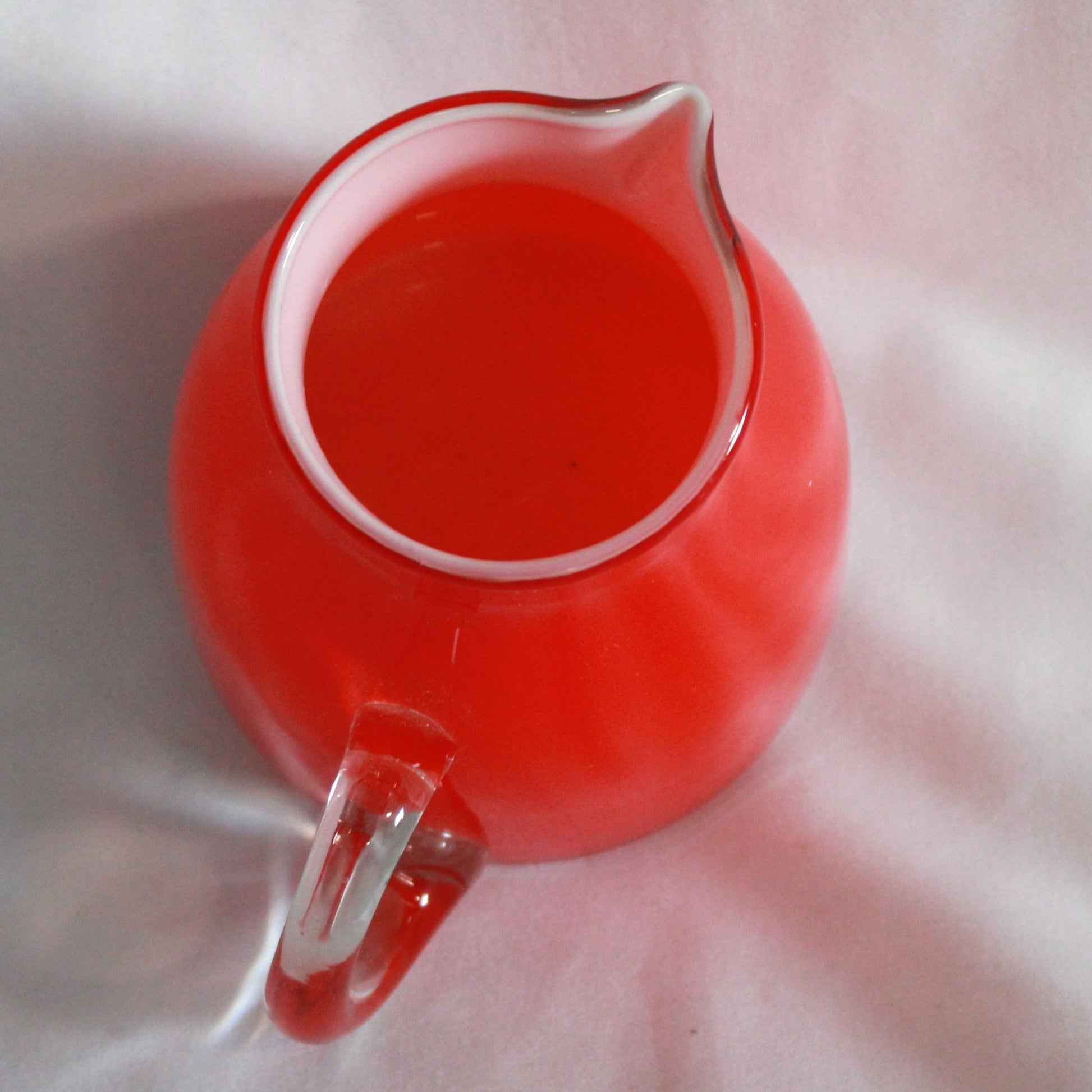 Red Cased Art Glass Creamer Pitcher with Clear Applied Handle