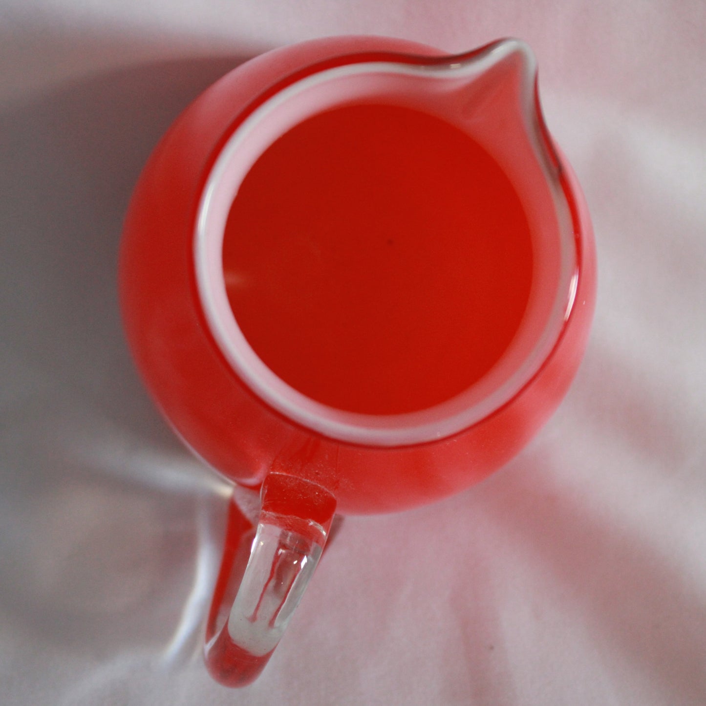 Red Cased Art Glass Creamer Pitcher with Clear Applied Handle