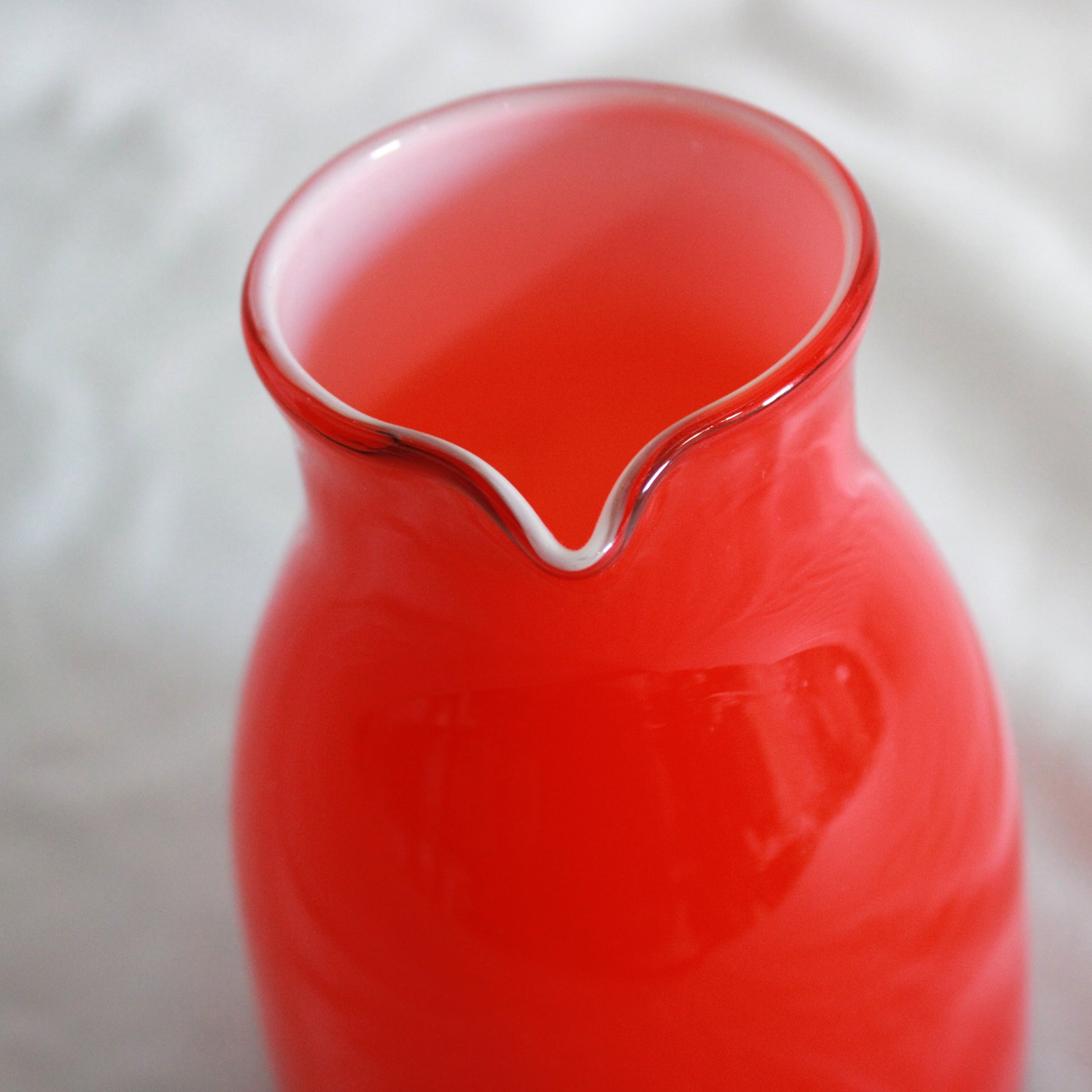Red Cased Art Glass Creamer Pitcher with Clear Applied Handle