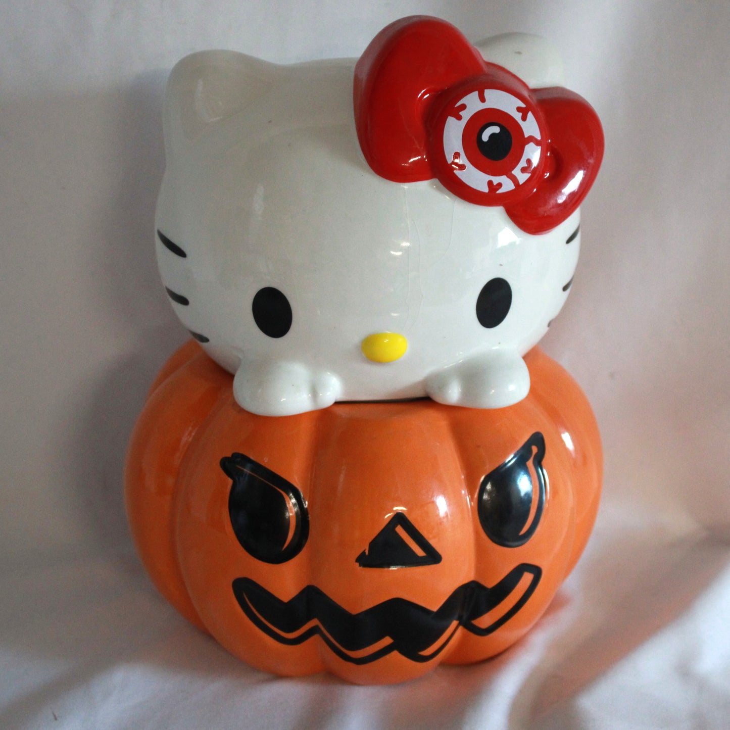 Sanrio Hello Kitty Spooky Eyeball Bow Halloween Pumpkin Ceramic Cookie Jar