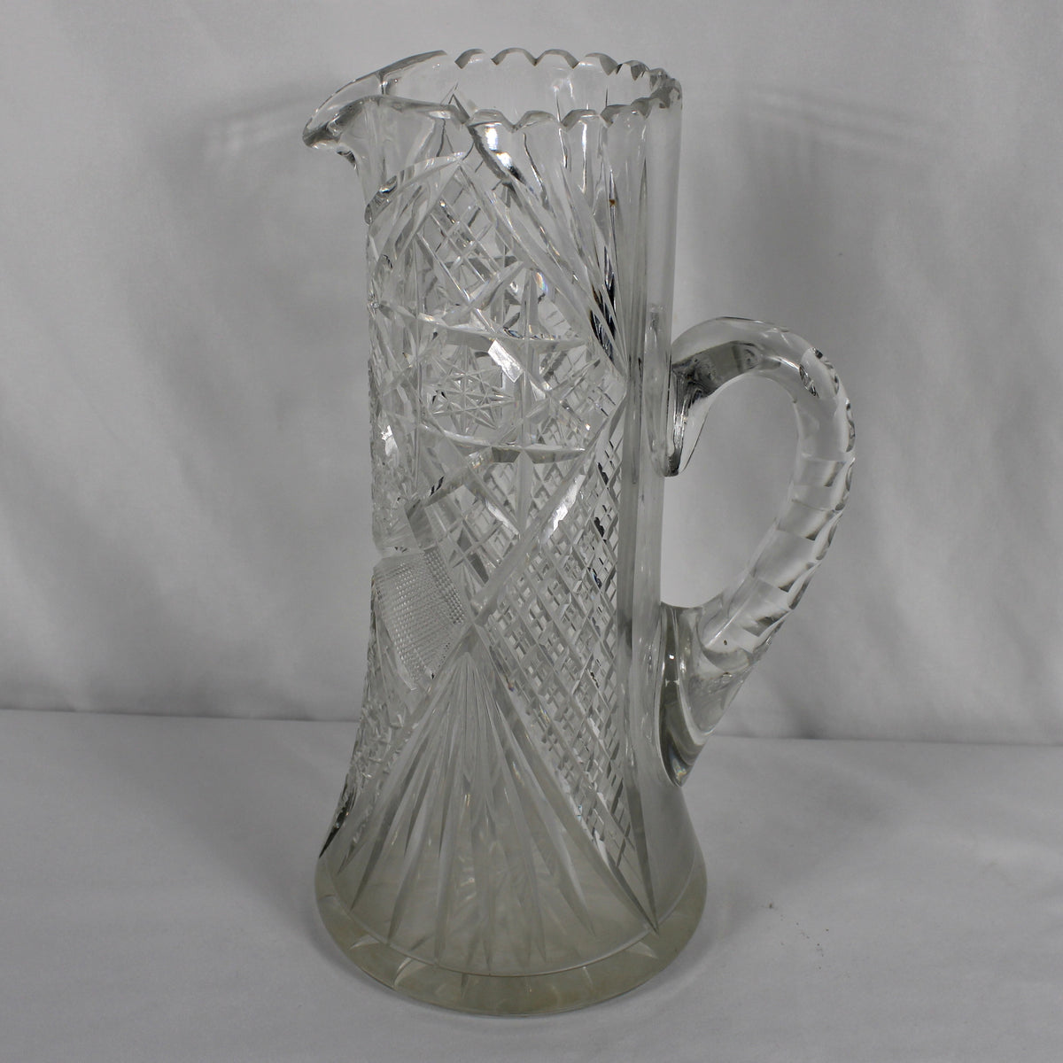 Vintage Cut Glass Water Pitcher with Pinwheel and Starburst Patterns